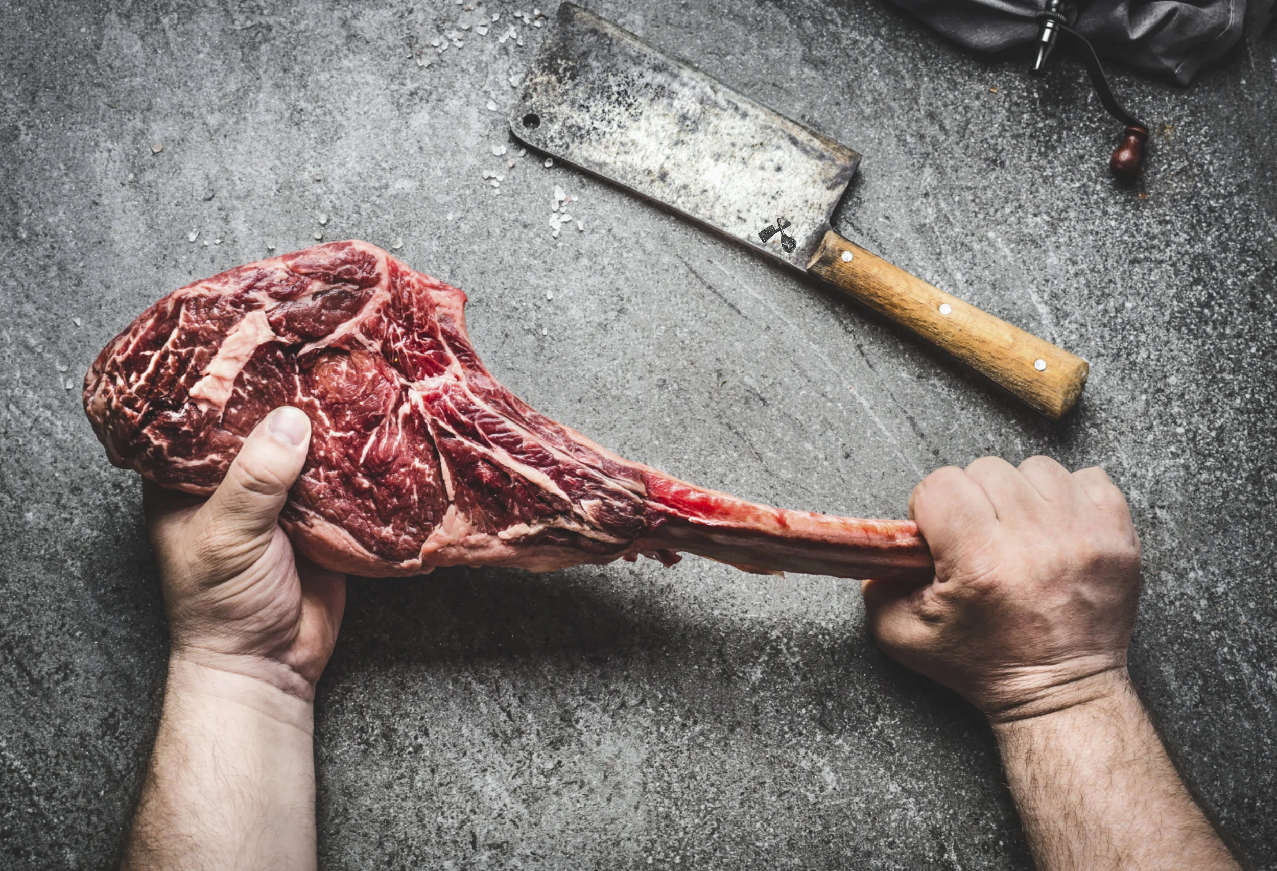 Butcher Holding Tomahawk.jpg