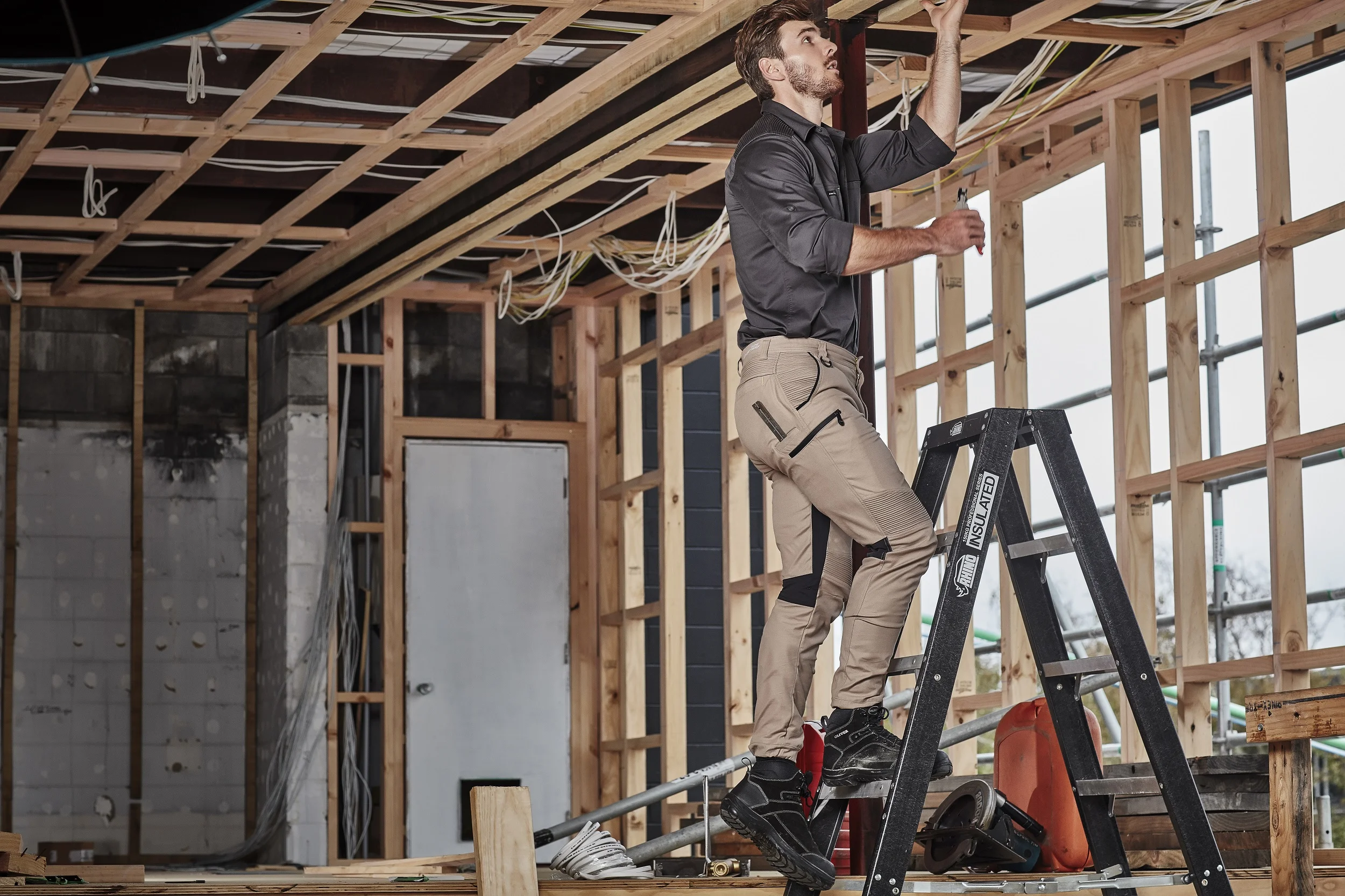 Buy workwear - Men's Syzmik Streetworx Stretch Pant on ladder
