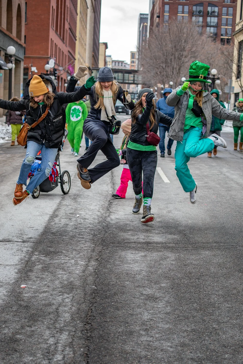 Women jumping at Saint Patrick's Day, Saint Paul, MN
