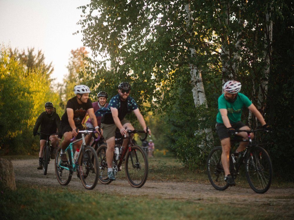 Cyclists riding through the woods during the first lap of the Bandit Cross