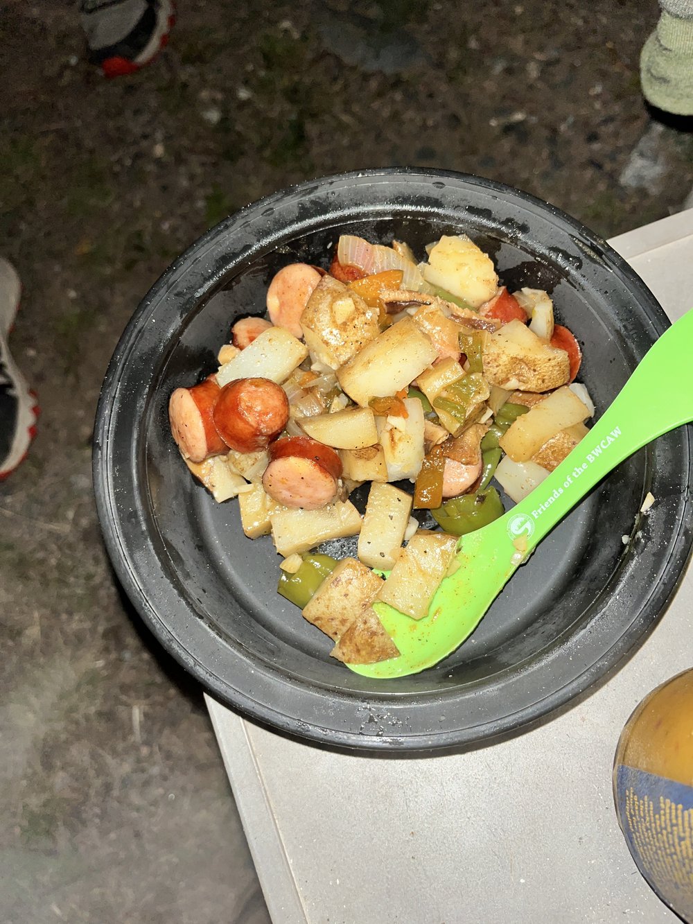 Potatoes, sausage, peppers, and chipotle seasoning fresh off the campfire