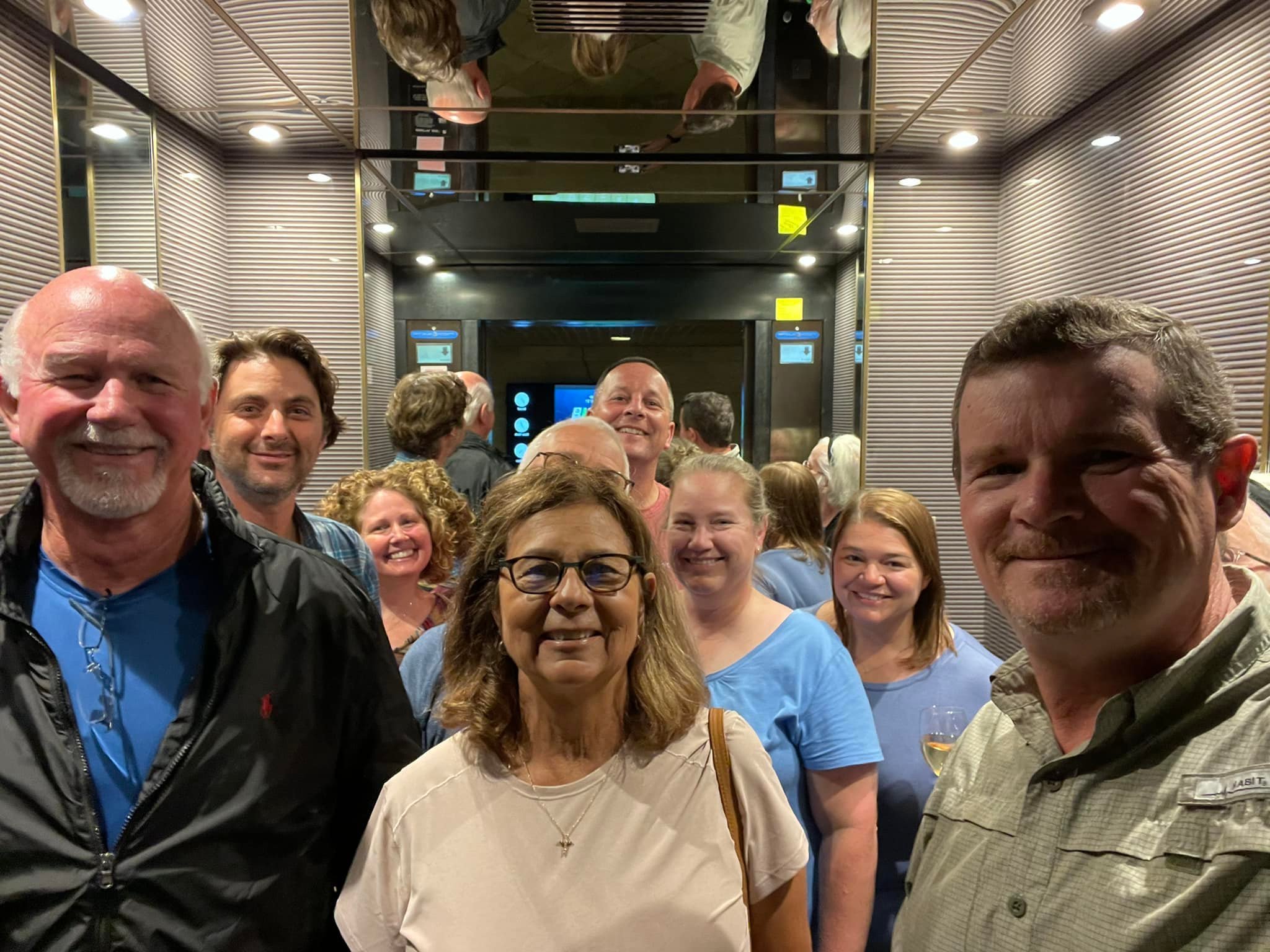  Our intrepid crew happily in the elevator after a long, busy day! 