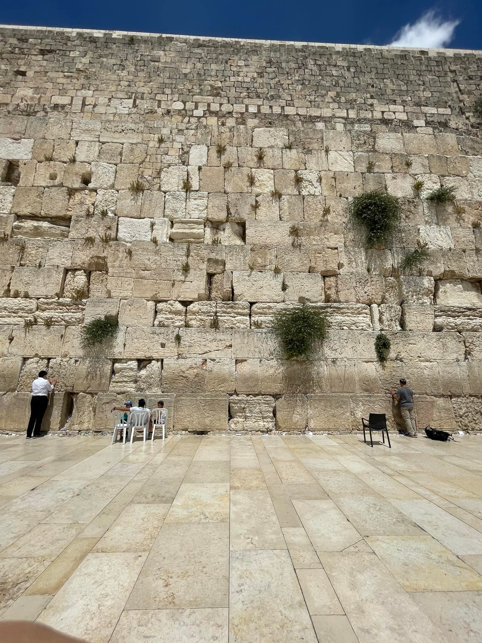  I’m honing in on the spot where I’m going to pray. And I’ve written prayers down on small pieces of paper to stuff into the cracks between the stones. About once a month, they gather up the notes that are stuck in there and bury them on the Mount of