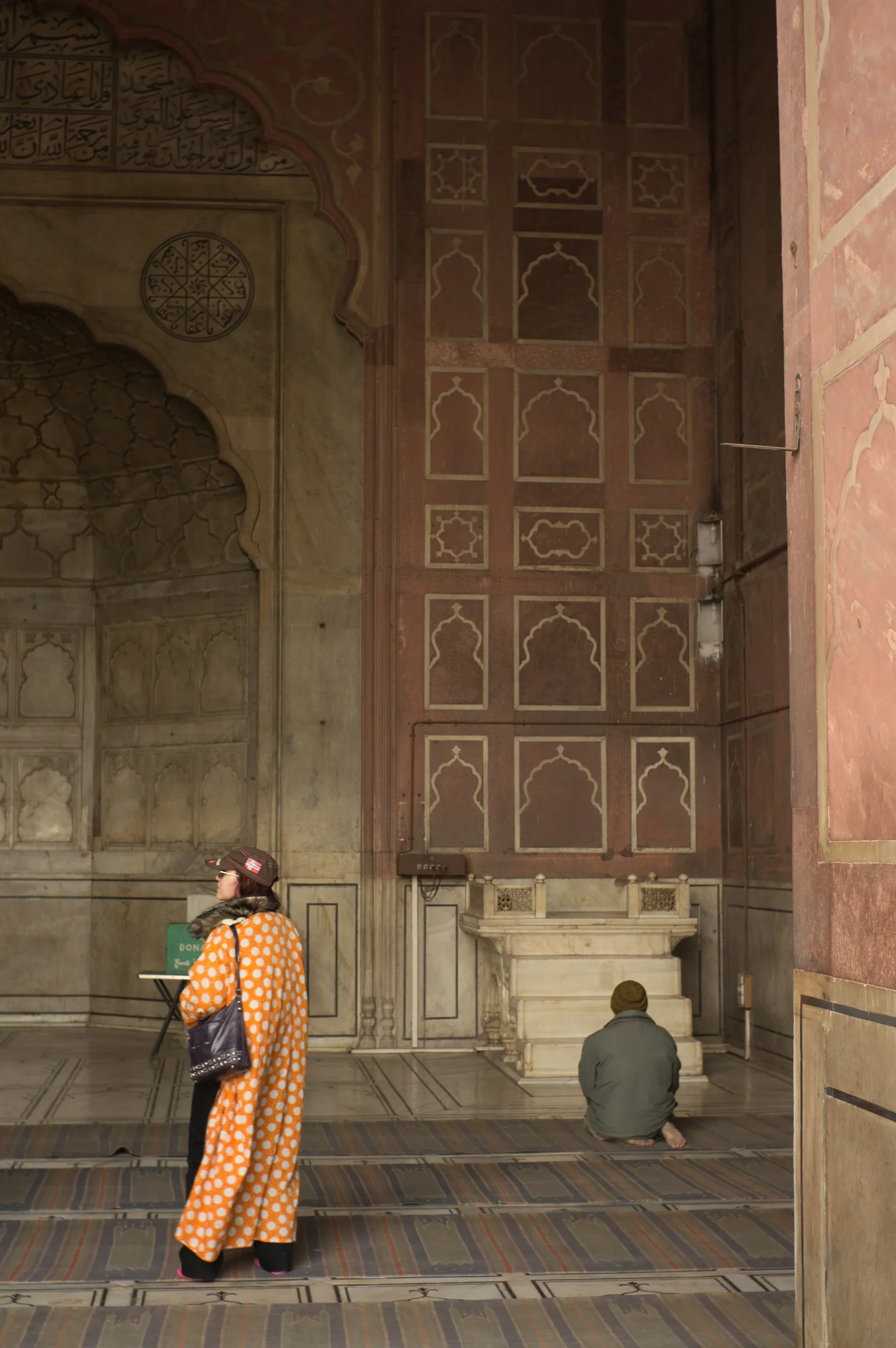 December 2011, Masjid-i Jahān-Numā (Jama Masjid) , Dehli, India. The fur collar and hot pink socks make the ensemble.