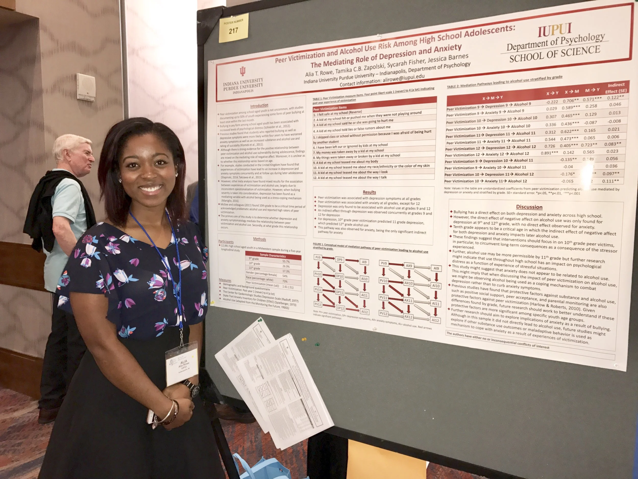 Alia Rowe and her poster at RSA.