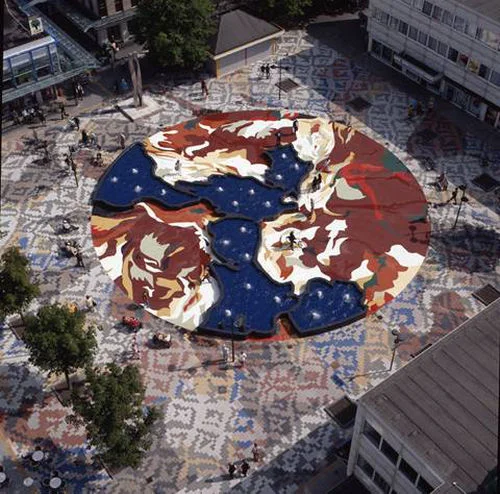 Design, pavement and pond, Buikslotermeerplein, 1996-97, In conjunction with the architect Kees van Santen, 37,000 pigmented concrete tiles, 700 m2 painted asphalt, 130 m2 pouring concrete, 34 light sources, 20 fountains. Construction: W. Woestenburg, contractors, De Rijp. Client: Amsterdam North City Council, with Delta Ontwikkelingsgroep
