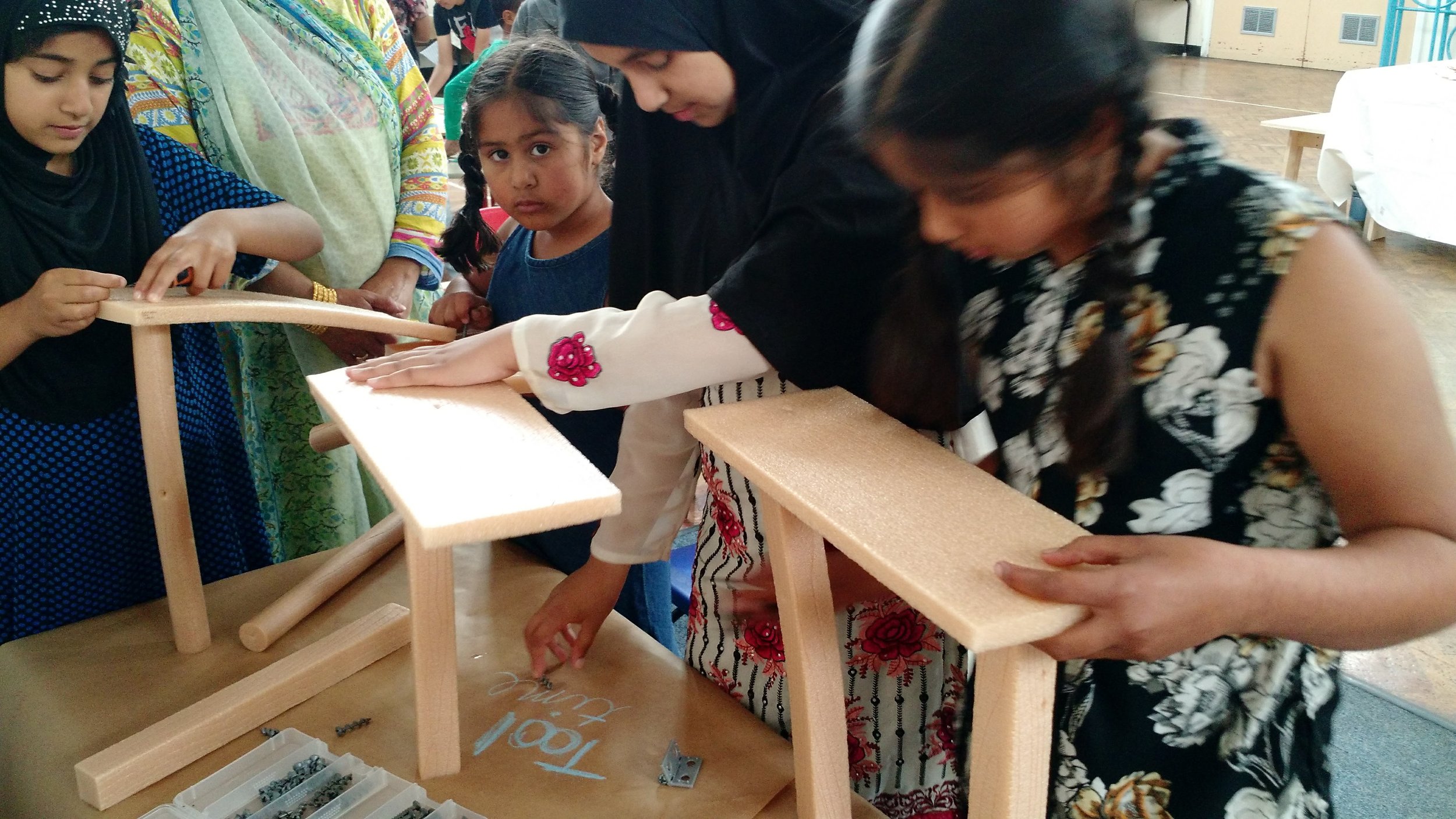 Girls working together to build a table
