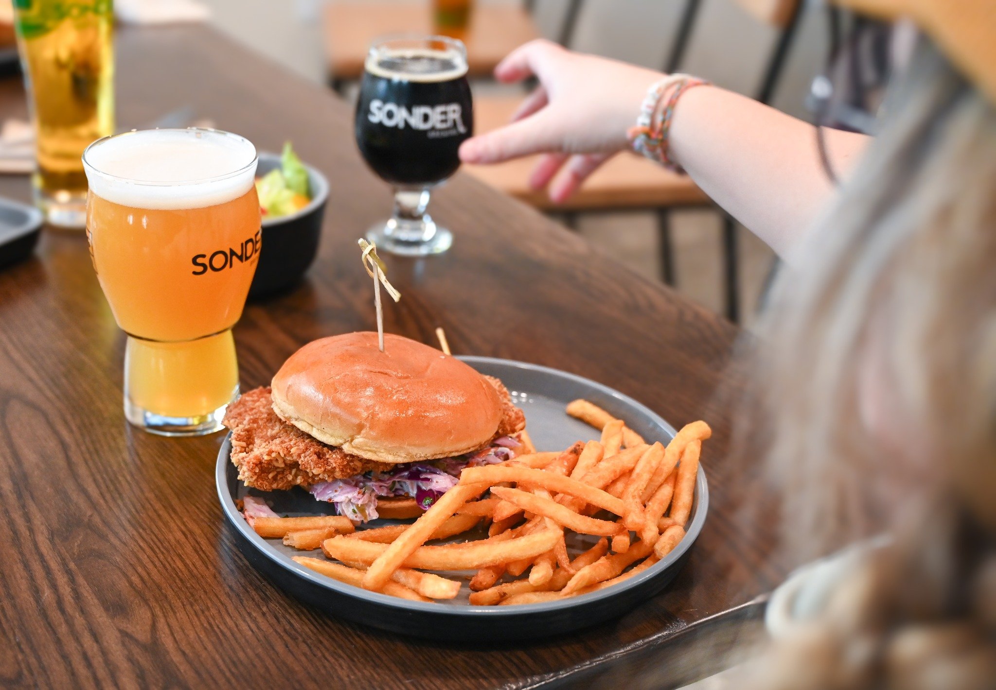Our Ramen Fried Chicken Sandwich is the perfect lunch meal! Made with Brined Chicken Thighs, Ramen Noodle Breading, Asian Slaw, Pickles, You Betcha! Aioli, all packed between a Brioche Bun! Add a side of fries and a You Betcha! NE IPA to top it all o