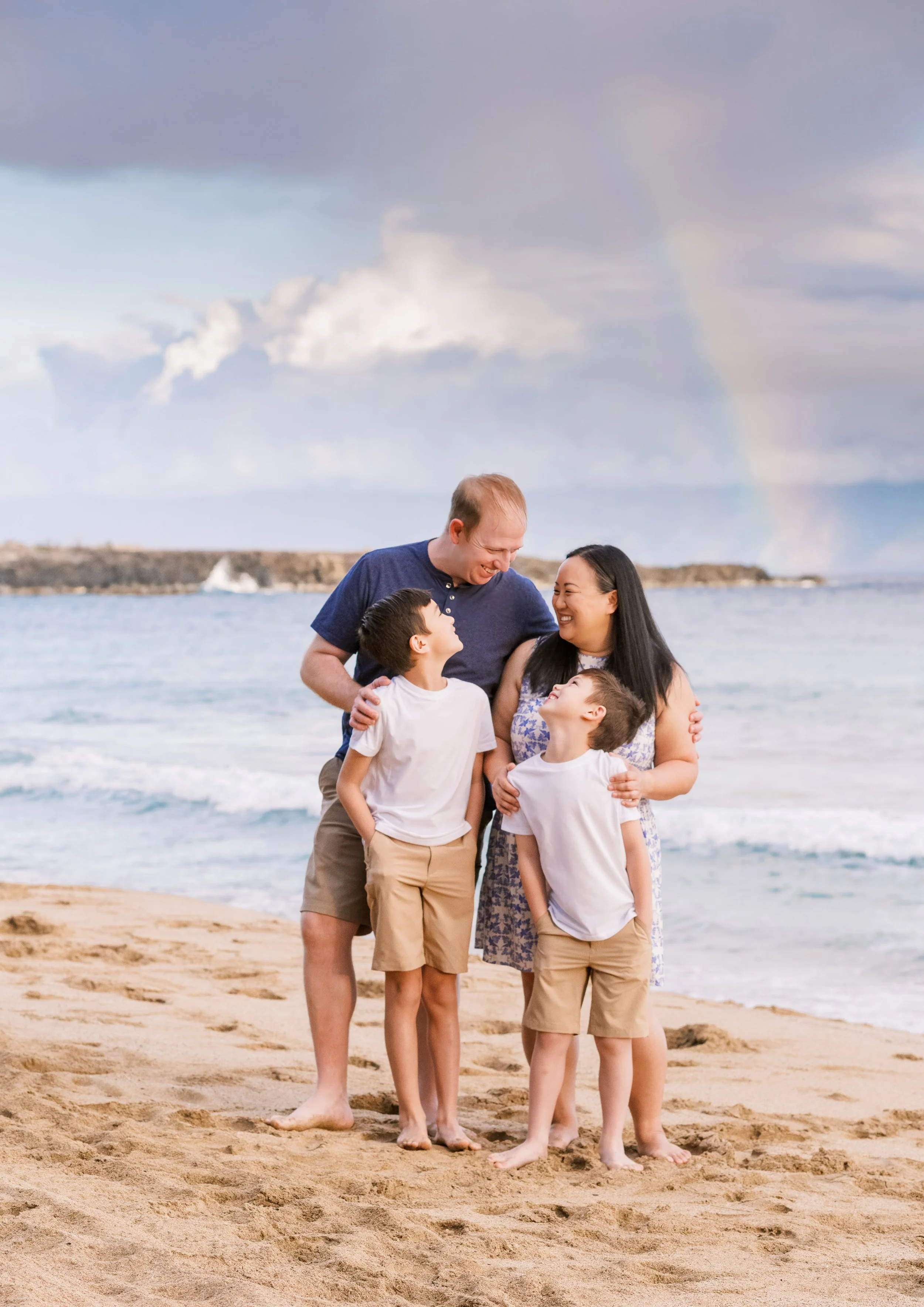 A rainbow at D.T. Flemings Beach in Kapalua Bay during a morning Maui family photoshoot.