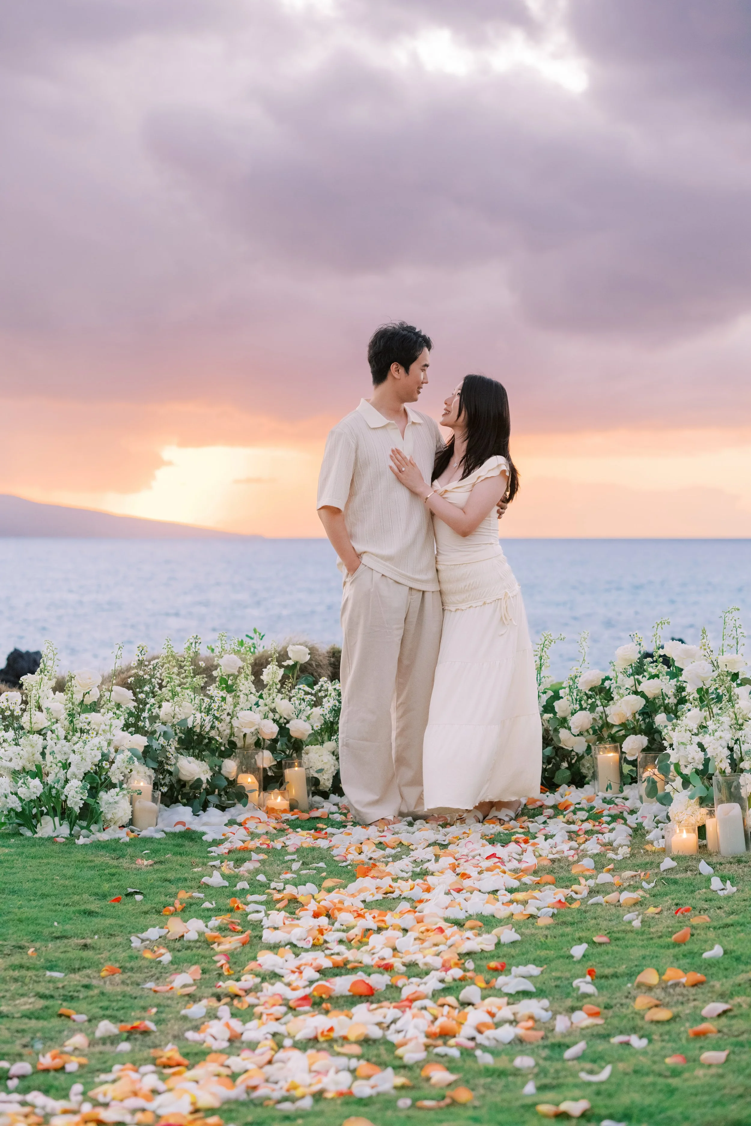 A vibrant sunset private proposal on Maui's South Side with flowers during sunset.
