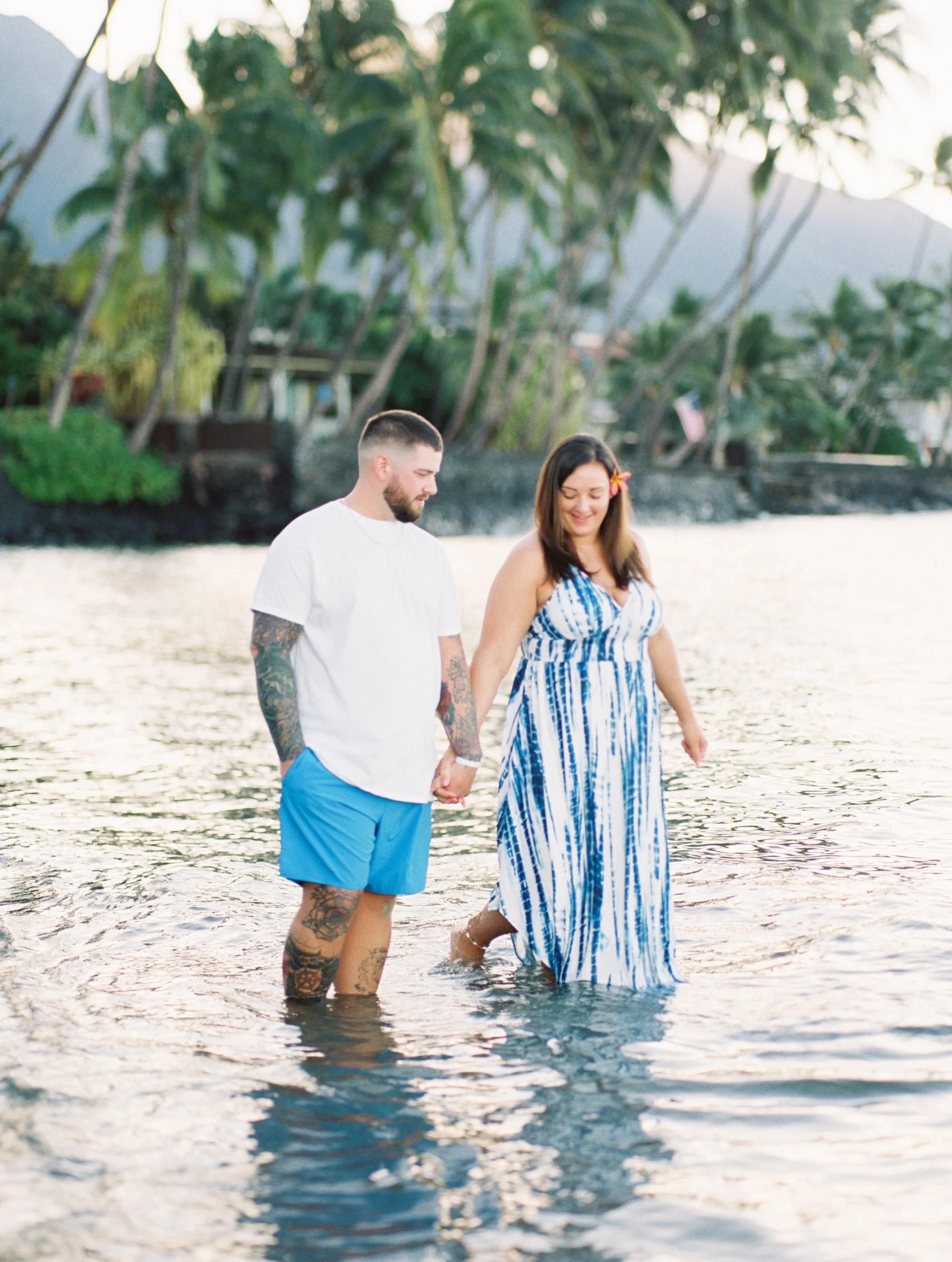 Maui couple photographed together on film in the ocean in Lahaina.