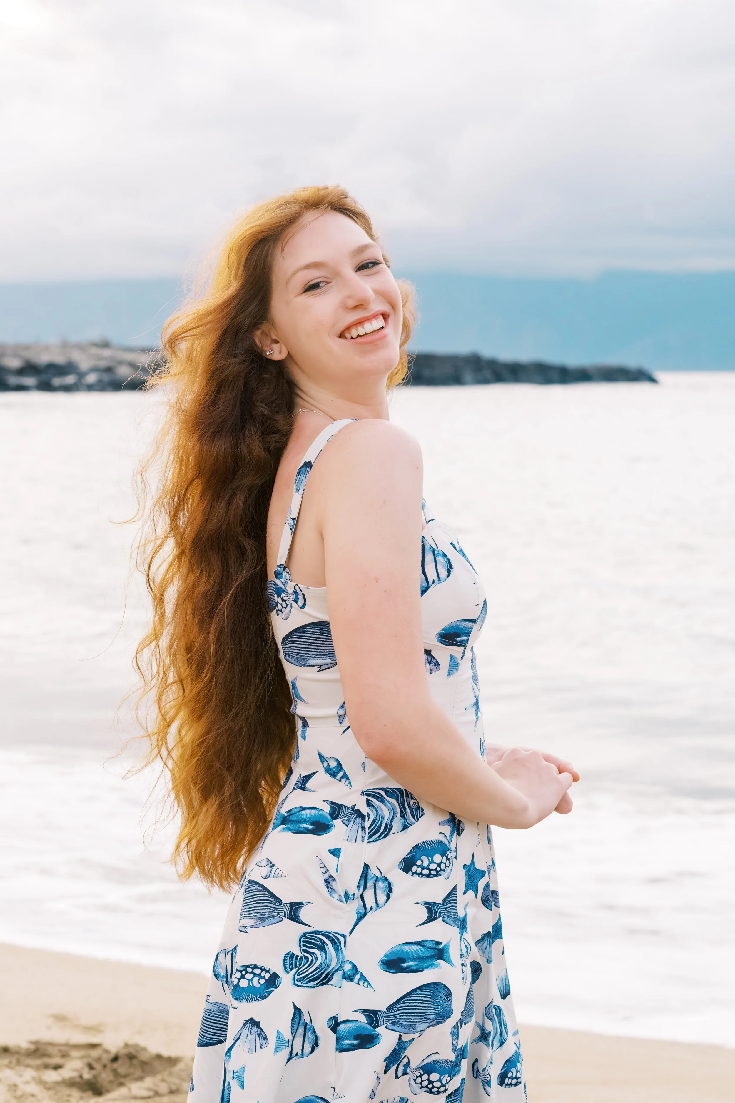 Senior portrait session at Kapalua Bay on Maui during sunset.
