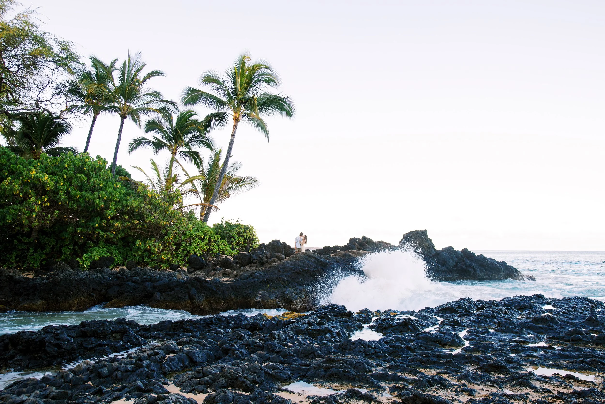 A sunrise surprise proposal photoshoot at Secret Beach known as Makena Cove in Maui Hawaii.