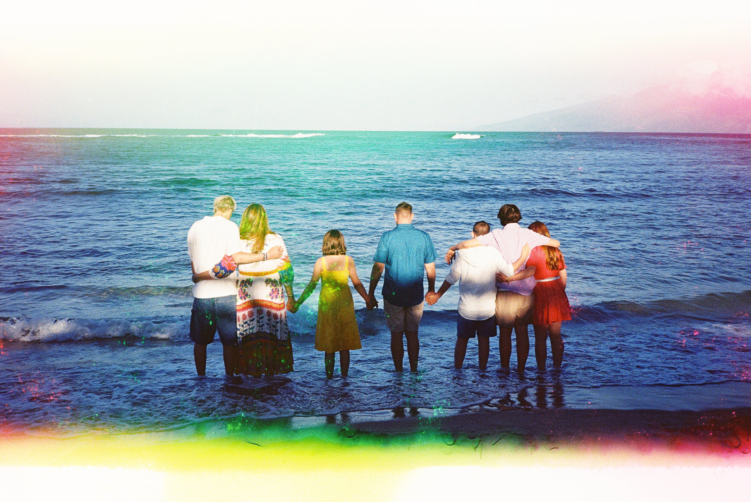A rainbow family photo captured on 35mm film at Kapalua Bay on Maui.