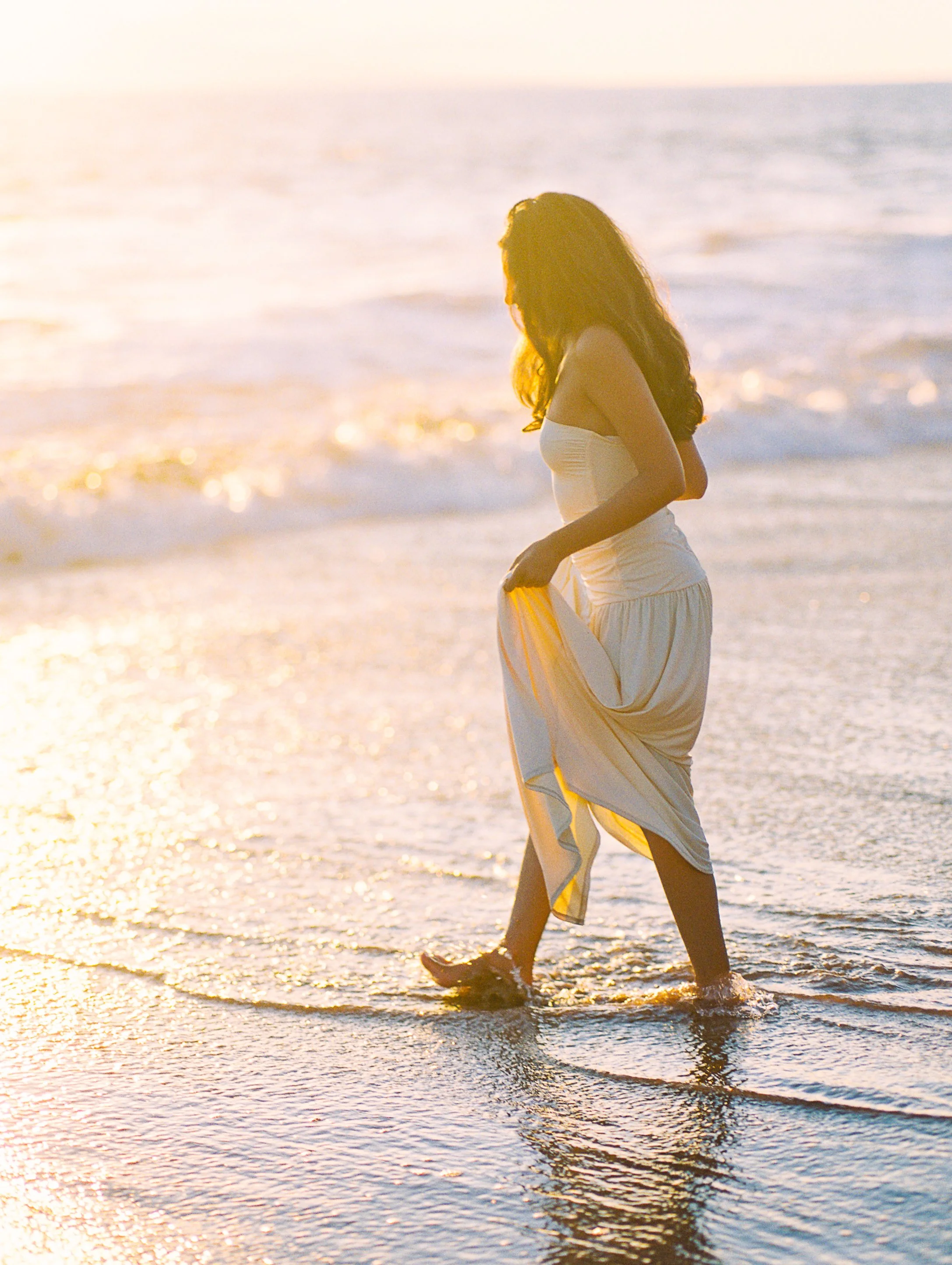 Sunset golden hour senior photos in front of the Grand Wailea on Maui on film.