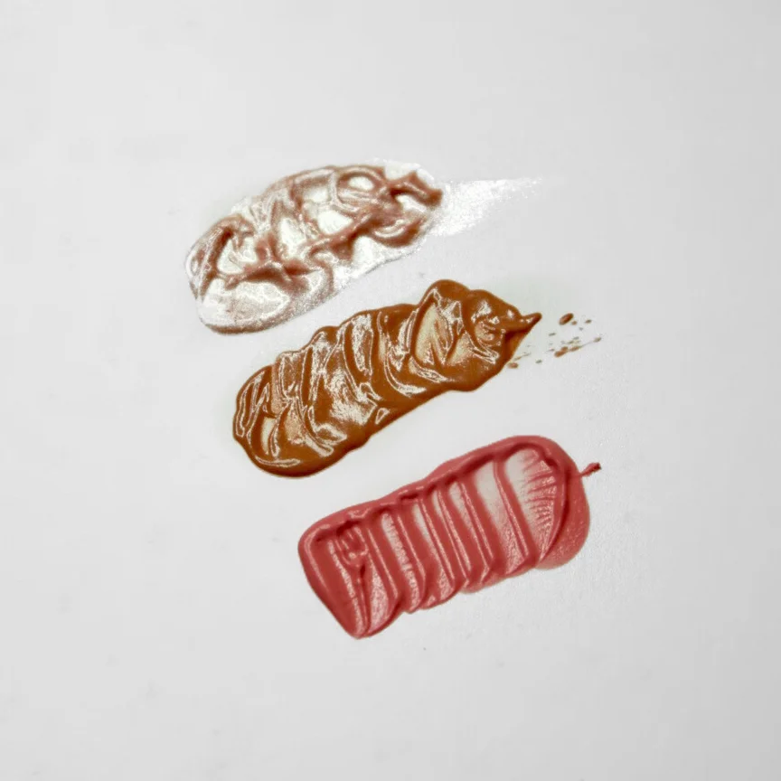 From top to bottom: NYX Born To Glow 'Sunbeam' liquid illuminator, Glossier 'Dusk' and 'Puff' Cloud Paints