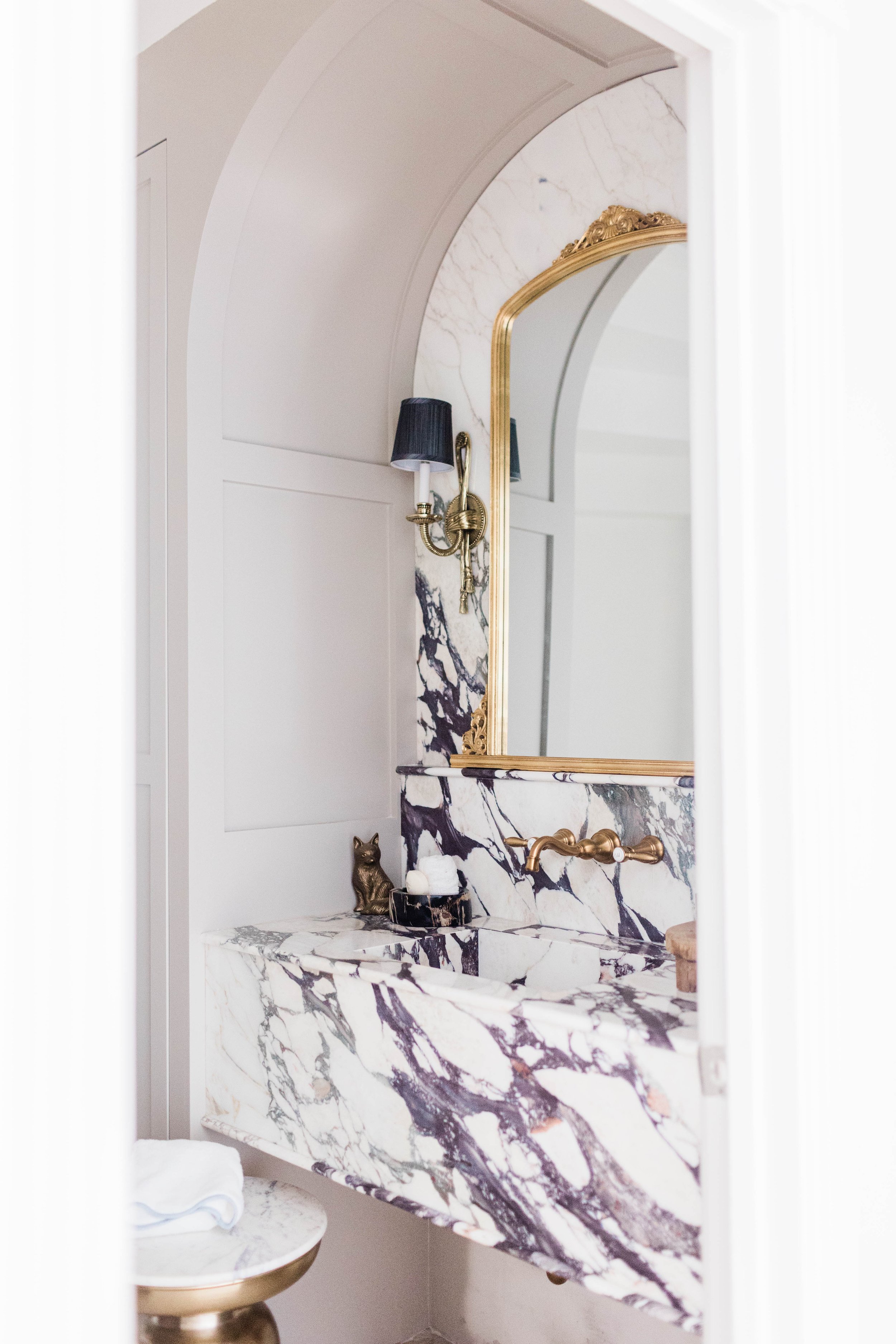 powder bathroom remodel home depot decor house renovation anthropologie mirror dupe marble backsplash candlesticks black white and gold bathroom