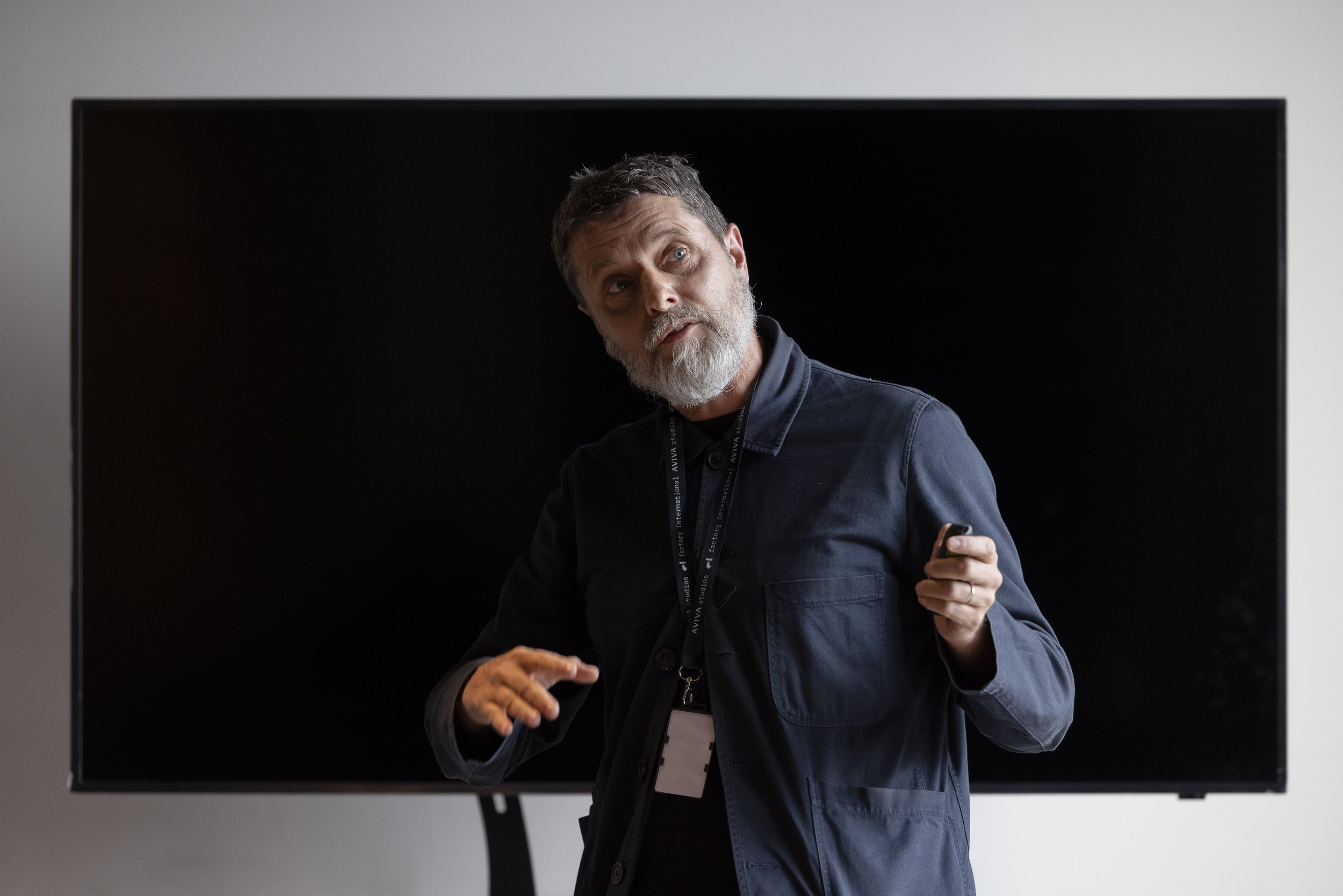 Gary Briggs of Factory Academy speaks at an Ubermorgen event for German cultural leaders in Manchester