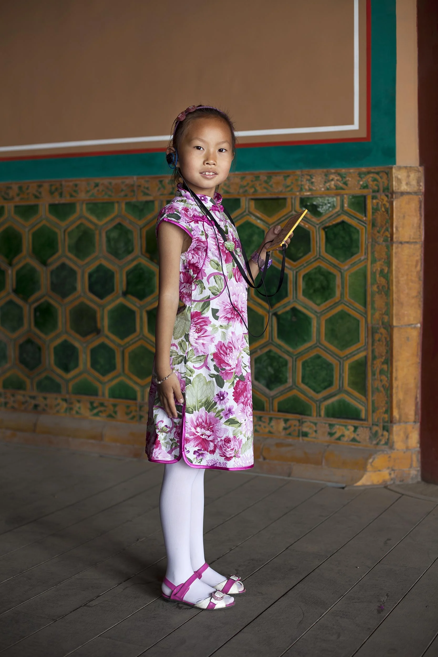 A portrait photograph of a young girl in the Forbidden City, Beijing , China Documentary photography part of a personal project