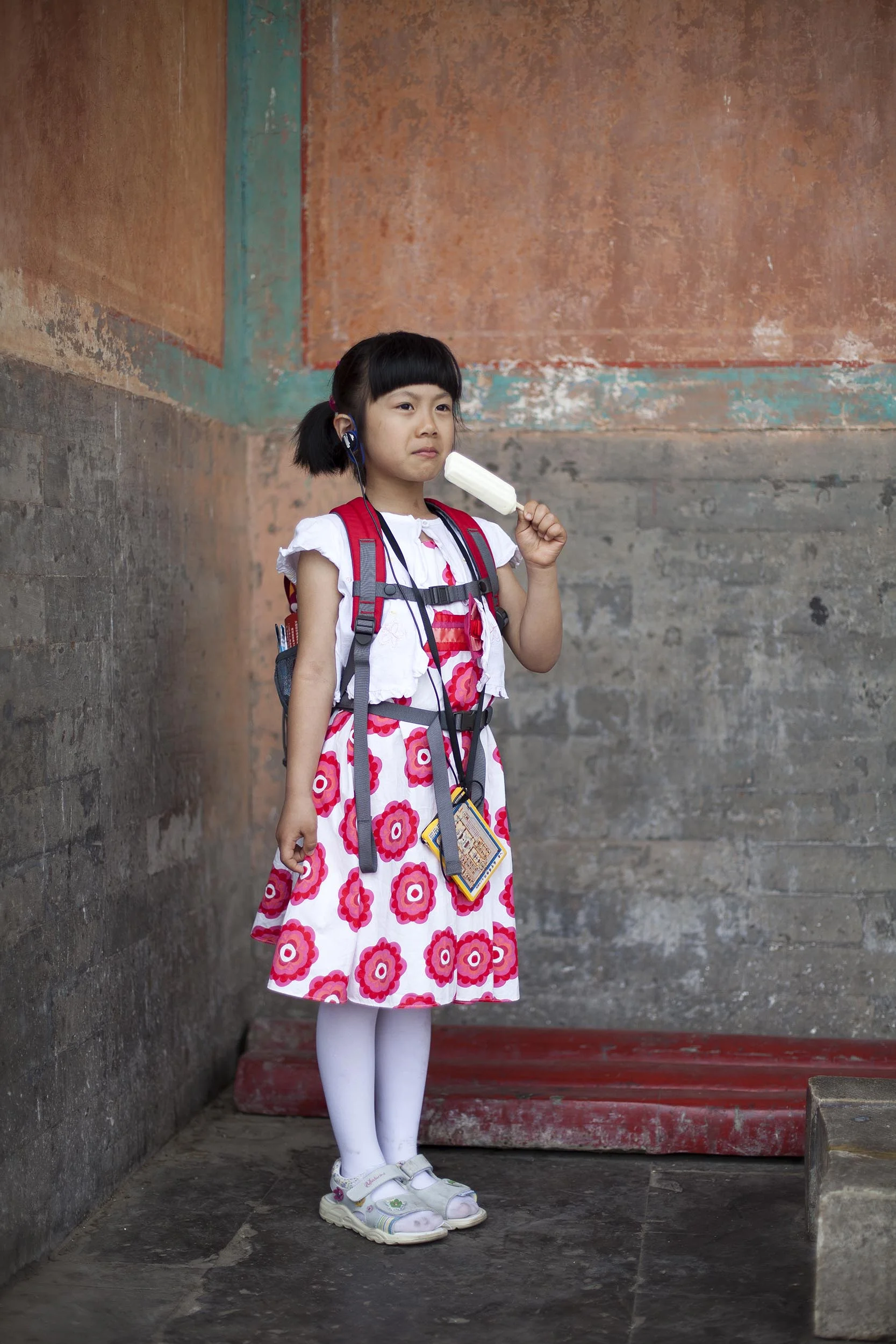  A portrait photograph of a young girl in the Forbidden City, Beijing , China  Documentary photography part of a personal project 