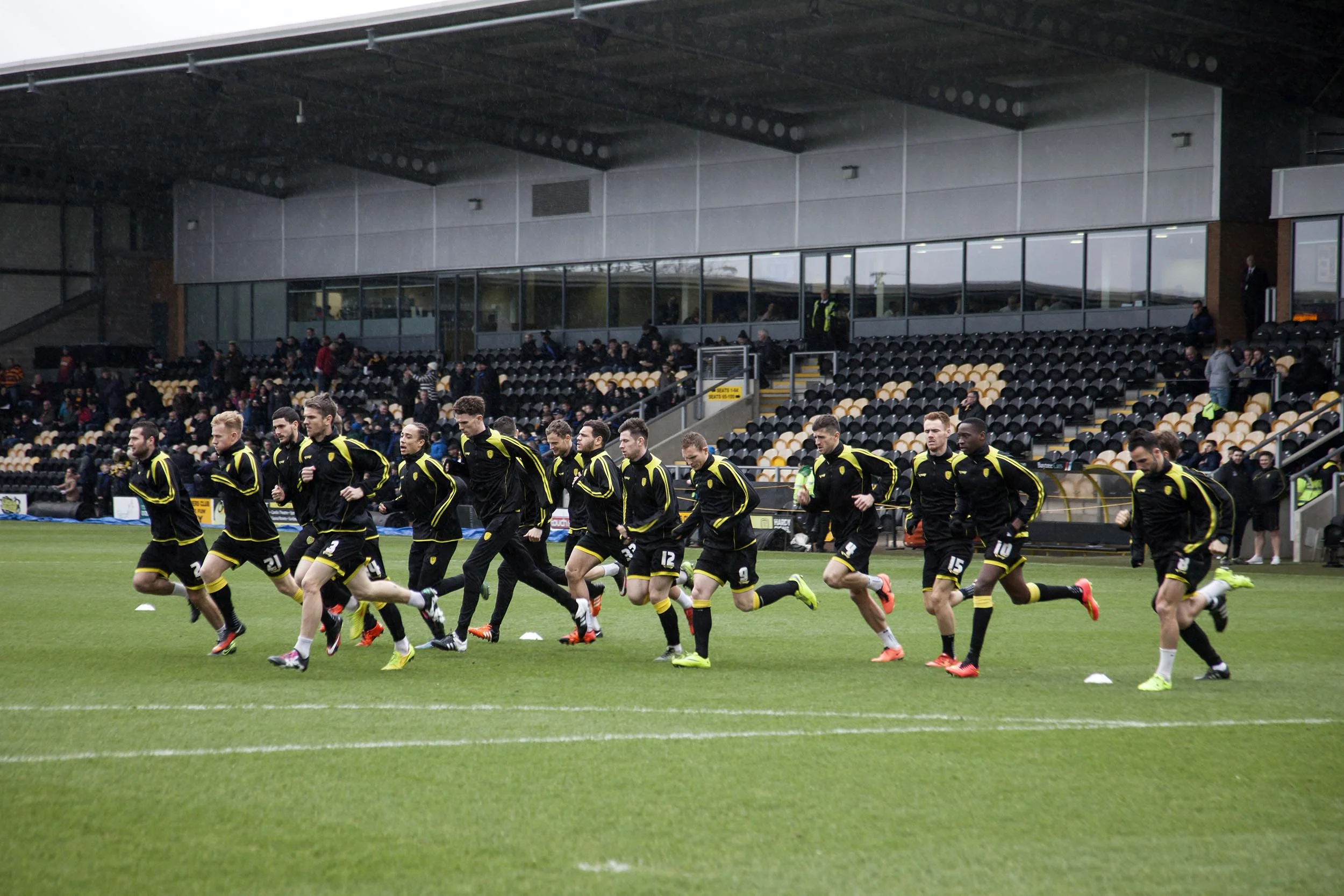 A documentary photograph of players warming up at Burton Albion I was commissioned as documentary photographer by German football magazine 11 Freunde.