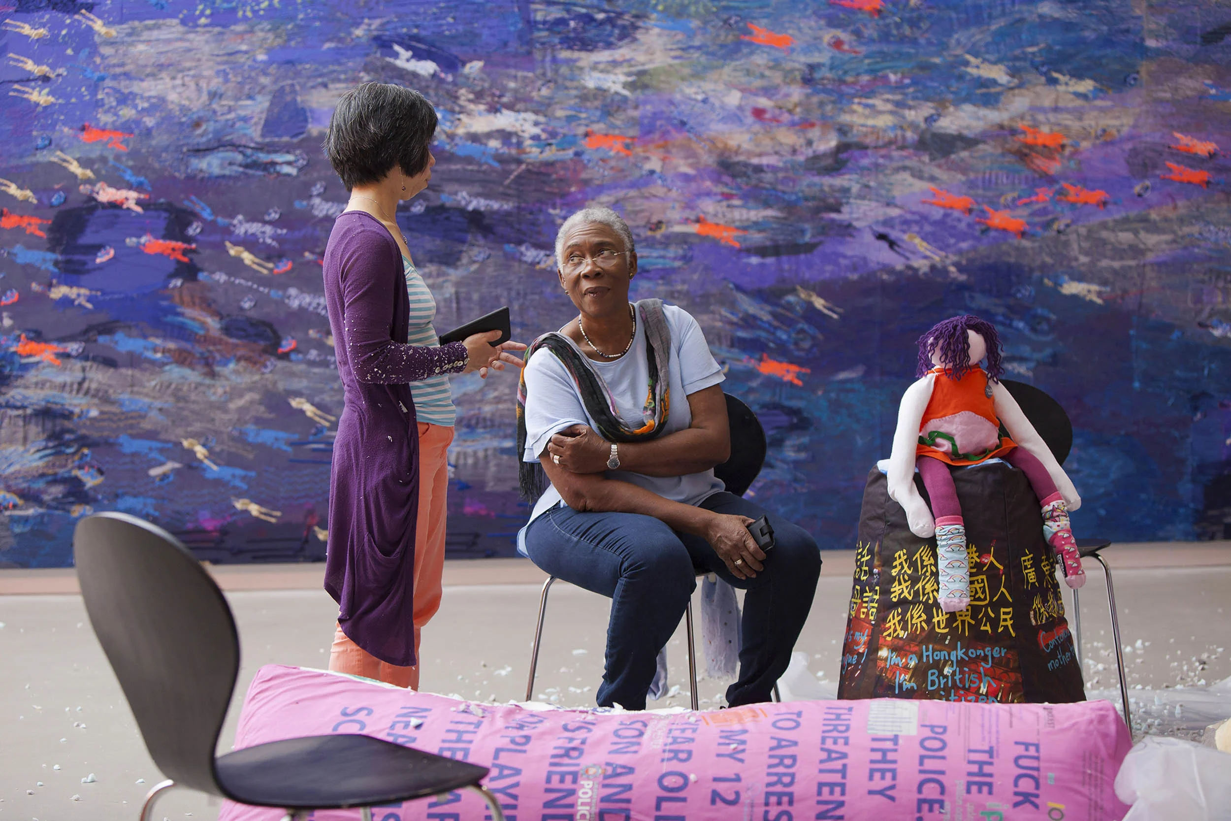 A documentary photograph of artists in discussion during an event. Photography commissioned by Whitworth Art Gallery, Manchester
