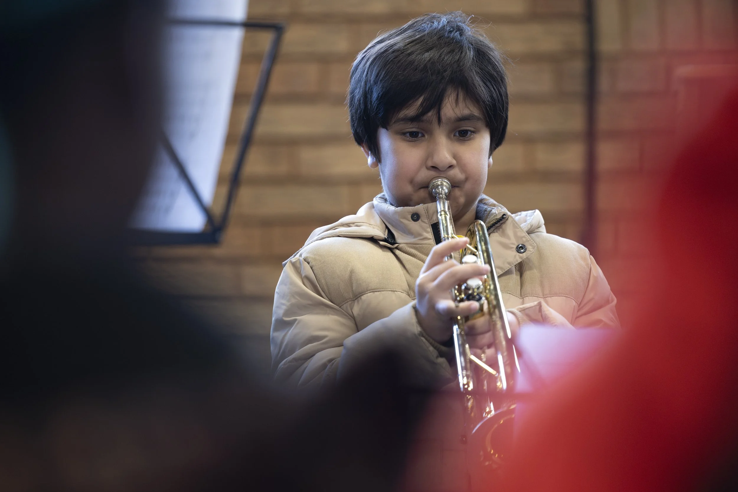  Boy playing trumpet at Olympias Music Foundation concert, Manchester – event photography by Manchester photographer David Oates 