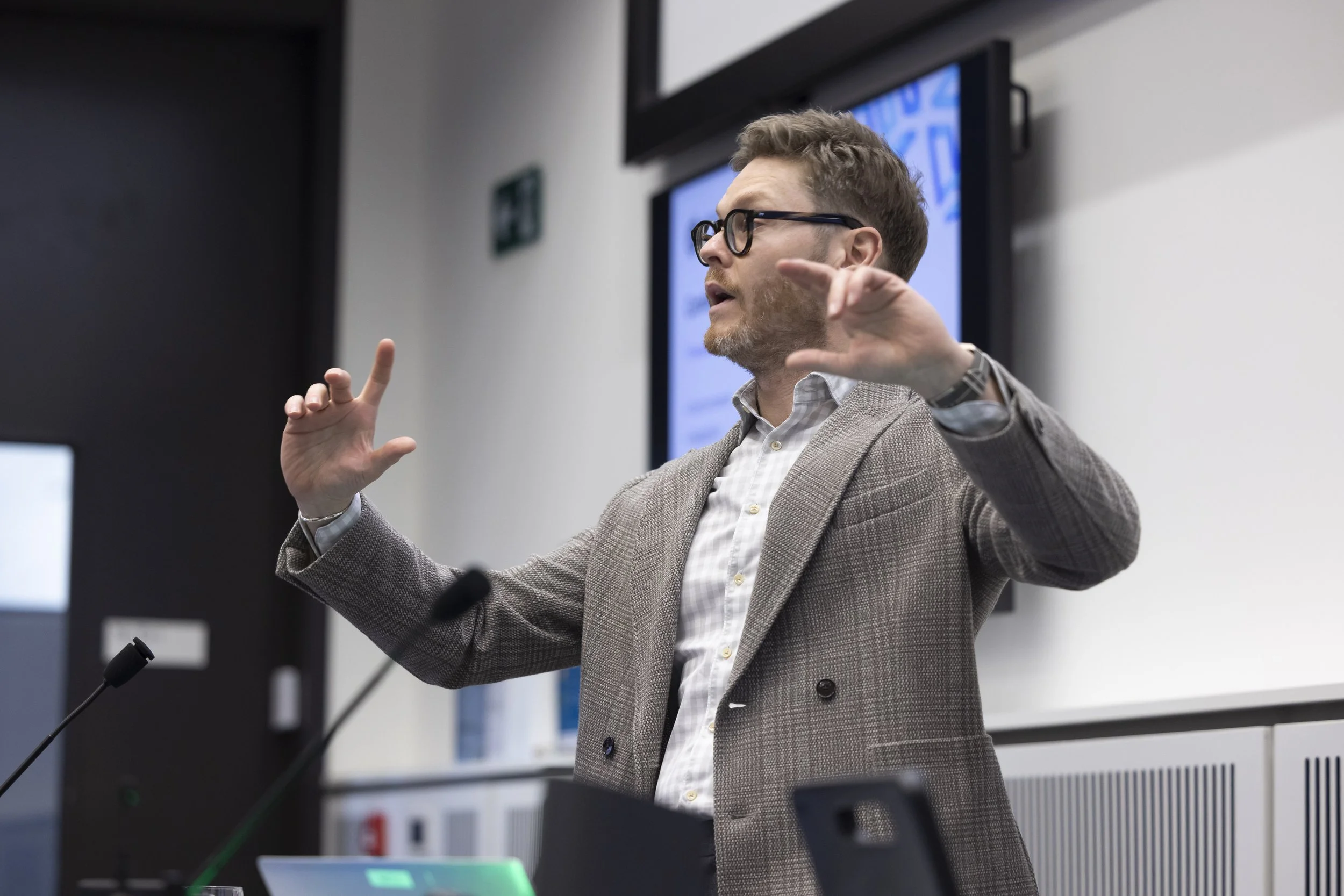 Manchester conference photographer capturing keynote speaker