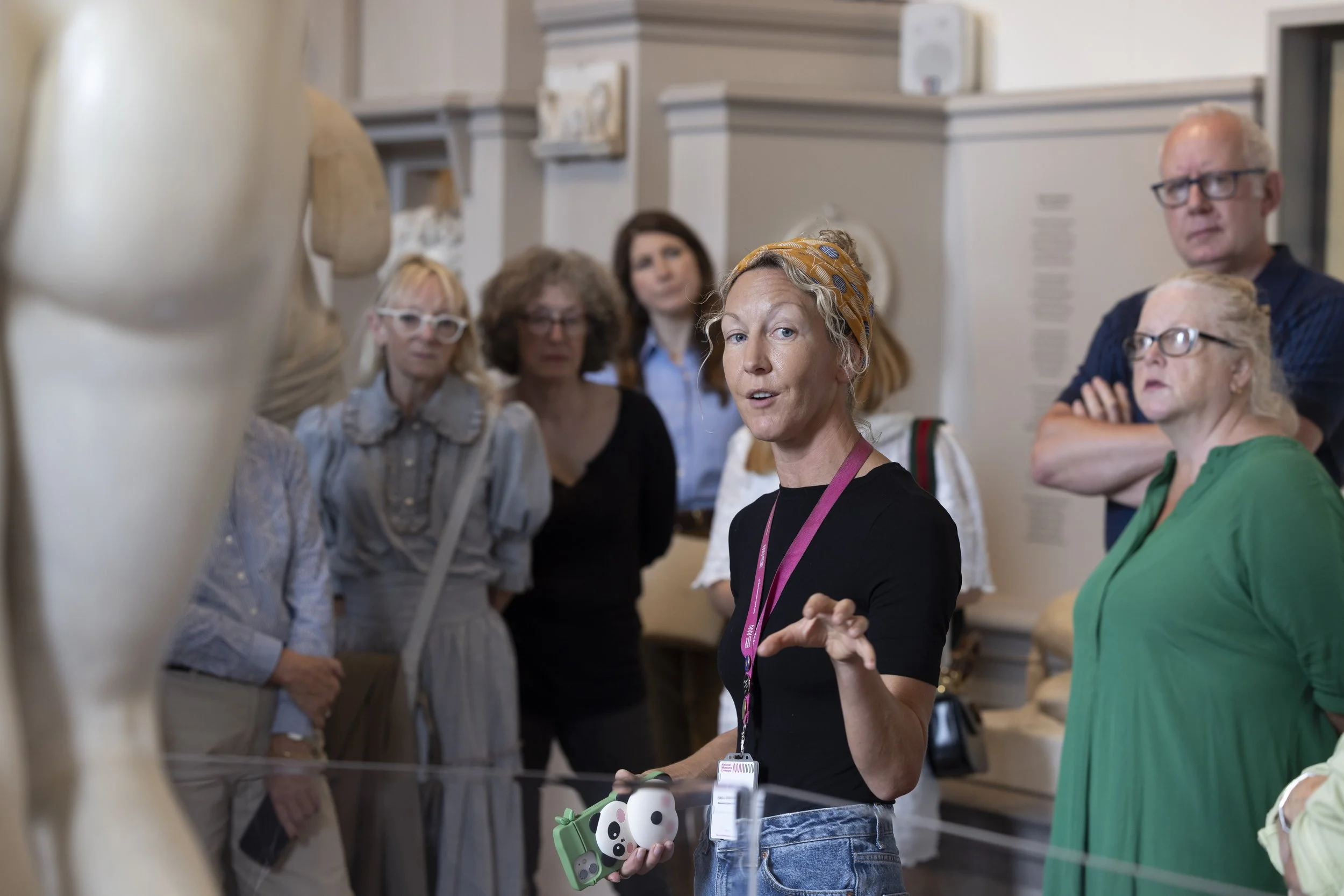 Tour guide showing guests around Walker Art Gallery, Liverpool