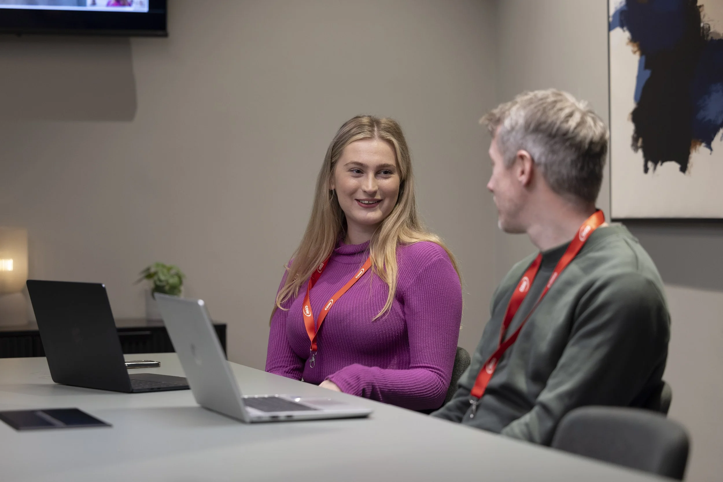 Office photography Manchester capturing staff collaborating and discussing ideas during corporate meeting at CDW