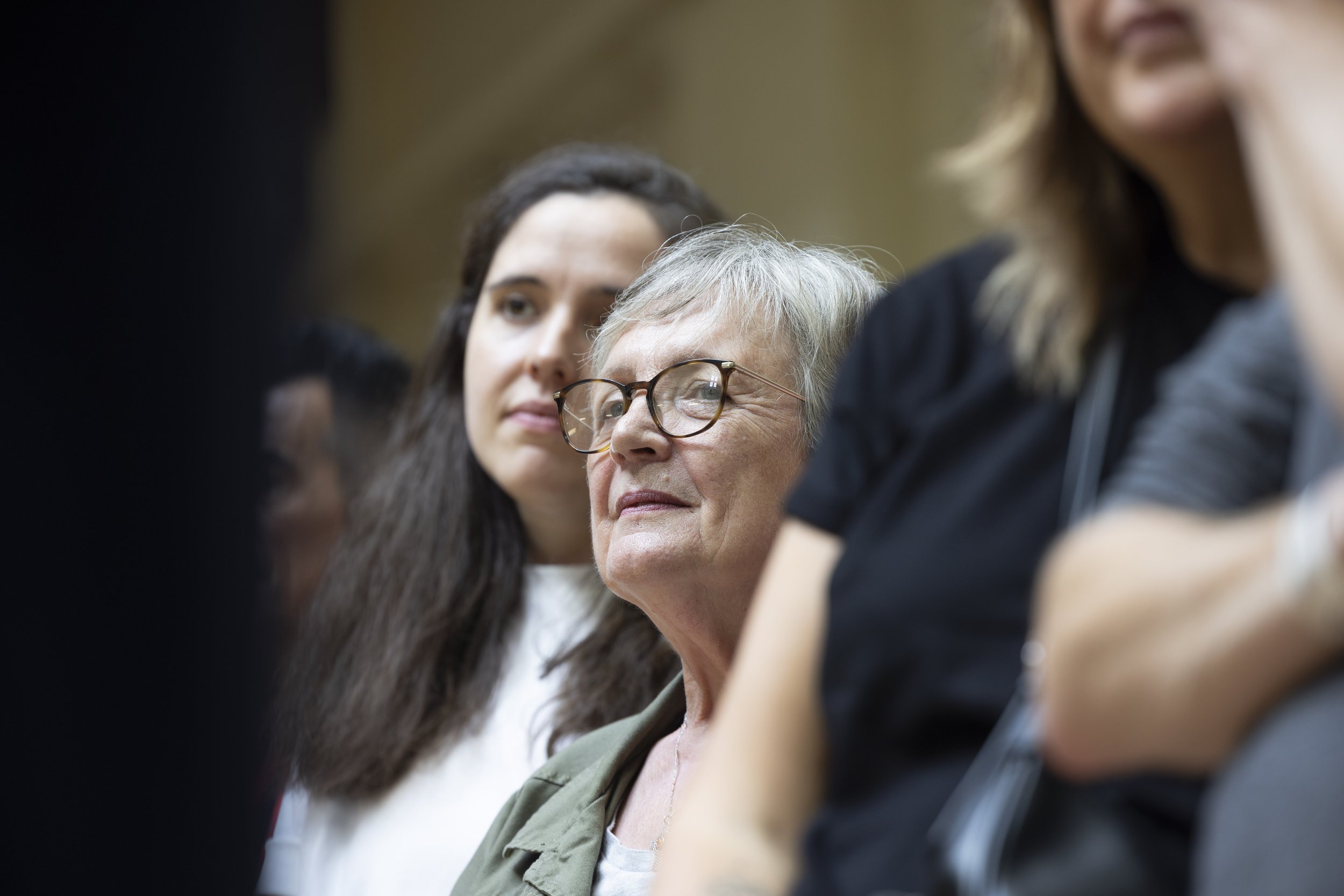 Close-up portrait of a Manchester United supporter listening to former players speaking during the third kit launch.