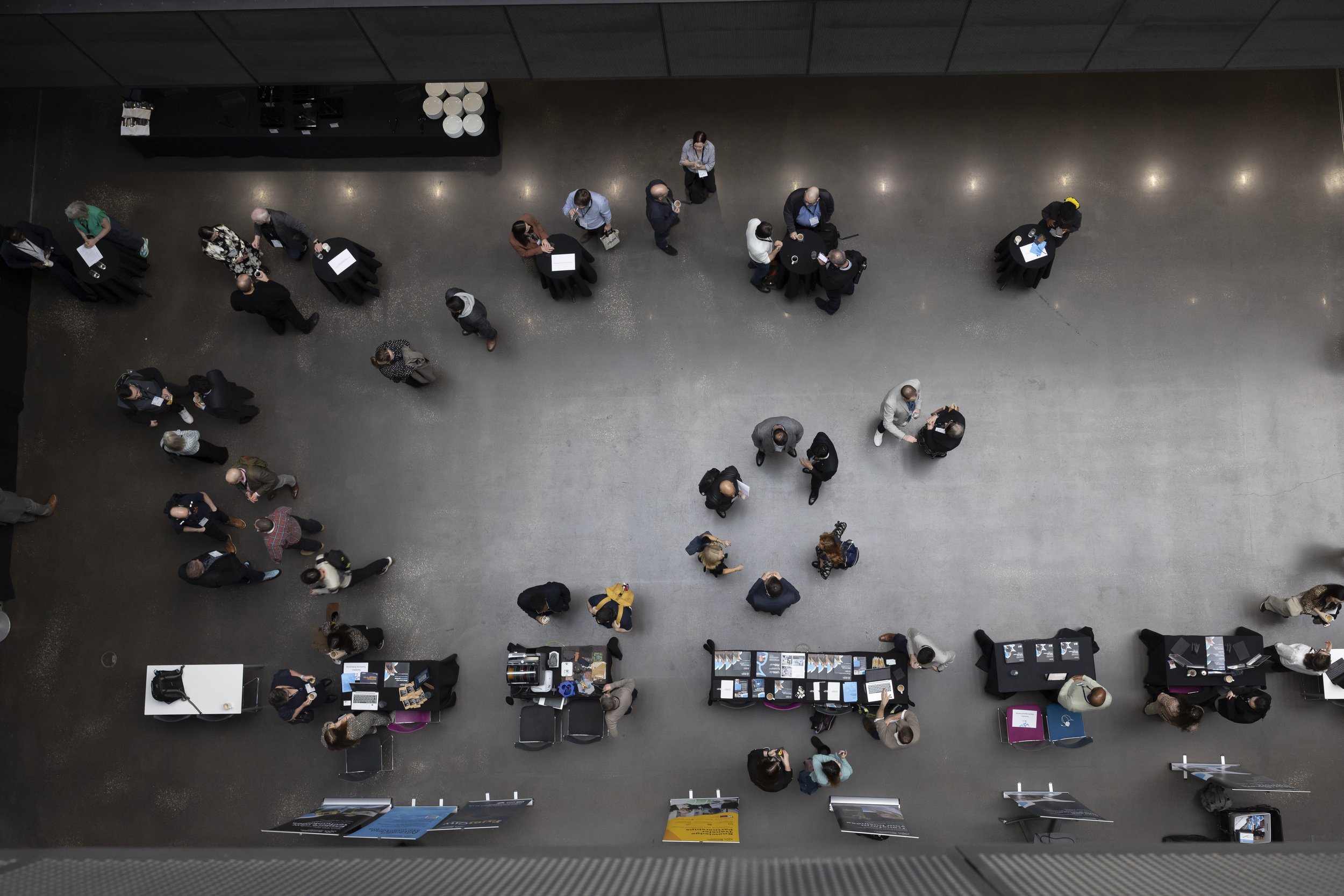 Delegates seen from above at a conference in Manchester