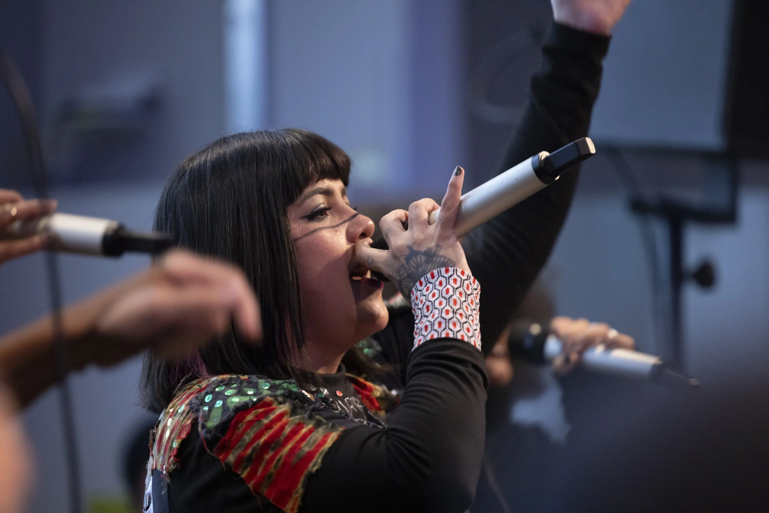 Brazilian vocalist performing live during evening programme at EarthSonic Live, Manchester Museum