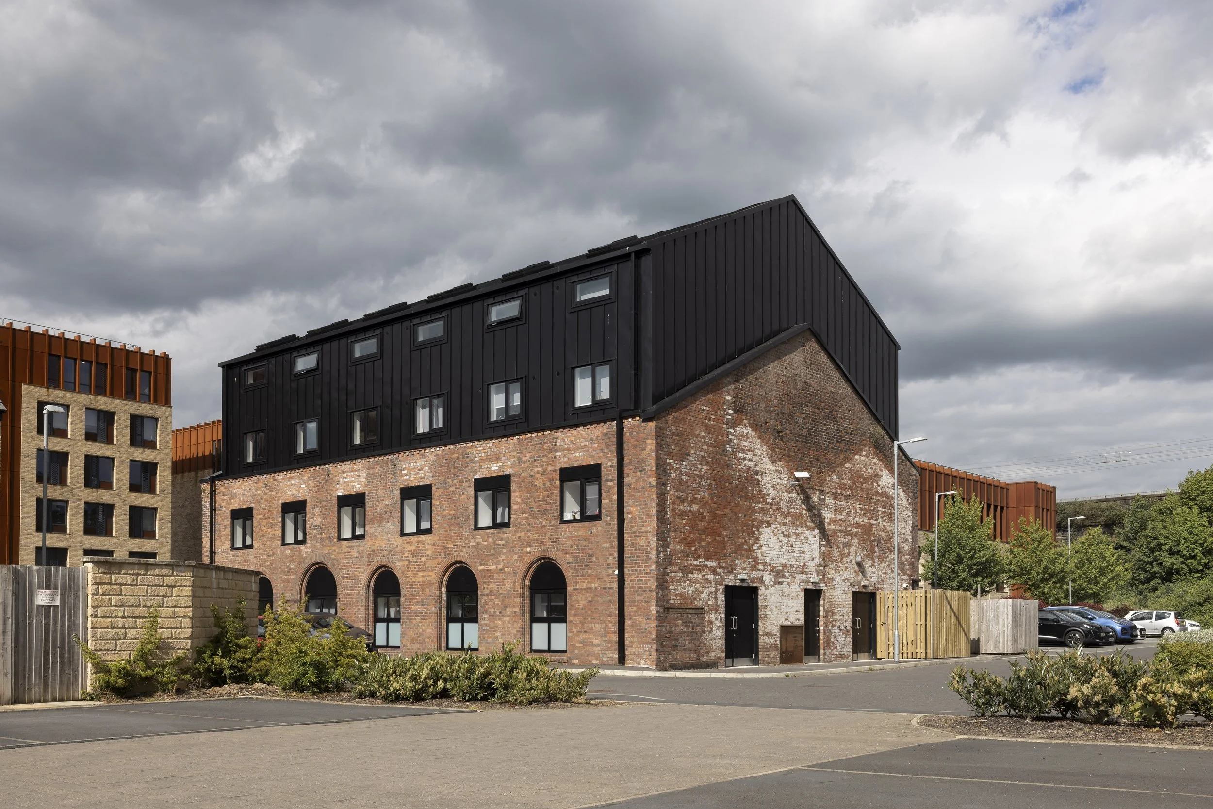 The Pump House by Just H Architects rear three-quarter exterior view showing restored industrial building in Lancaster
