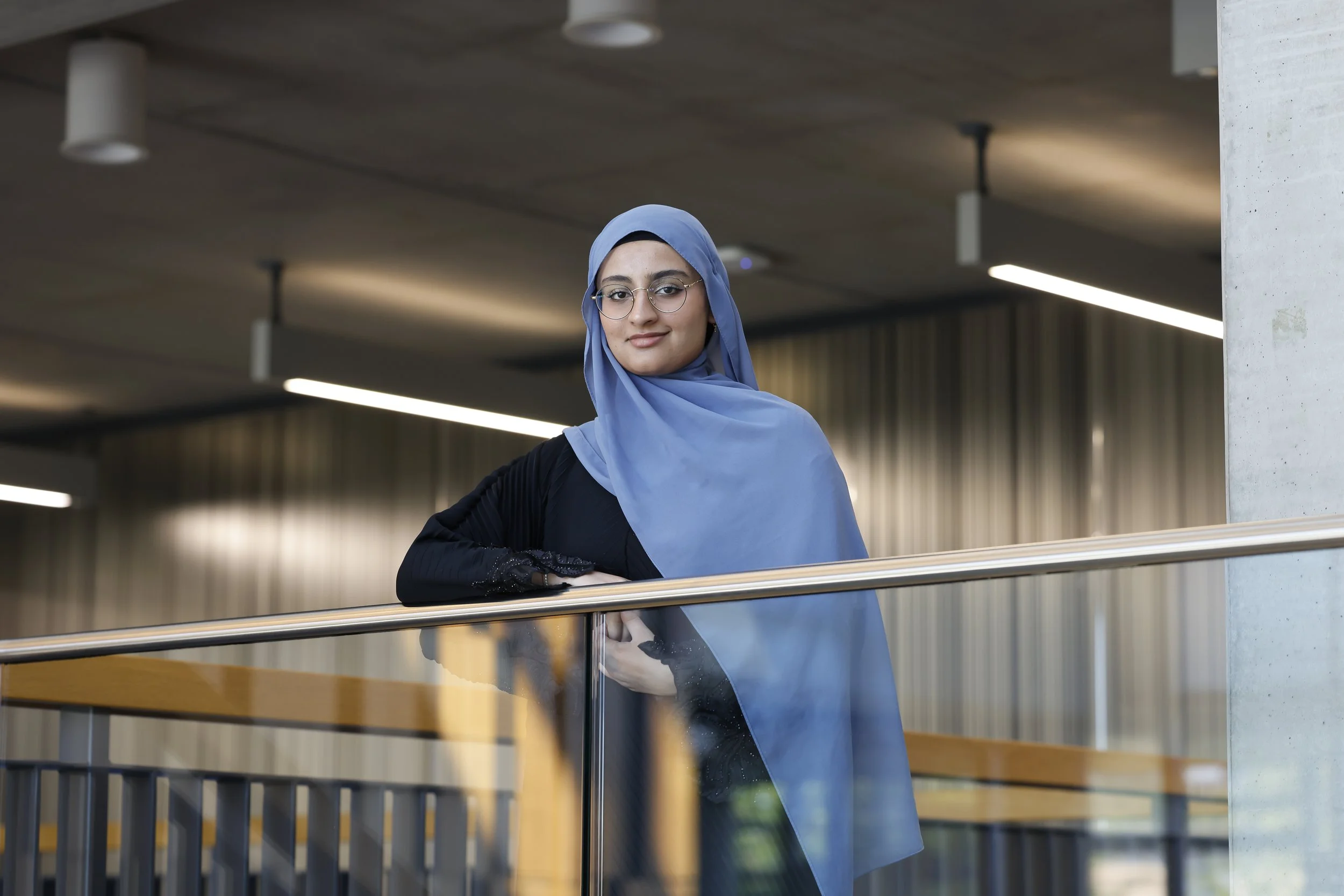 Environmental portrait of a Manchester Metropolitan University student award winner in the Brooks Building