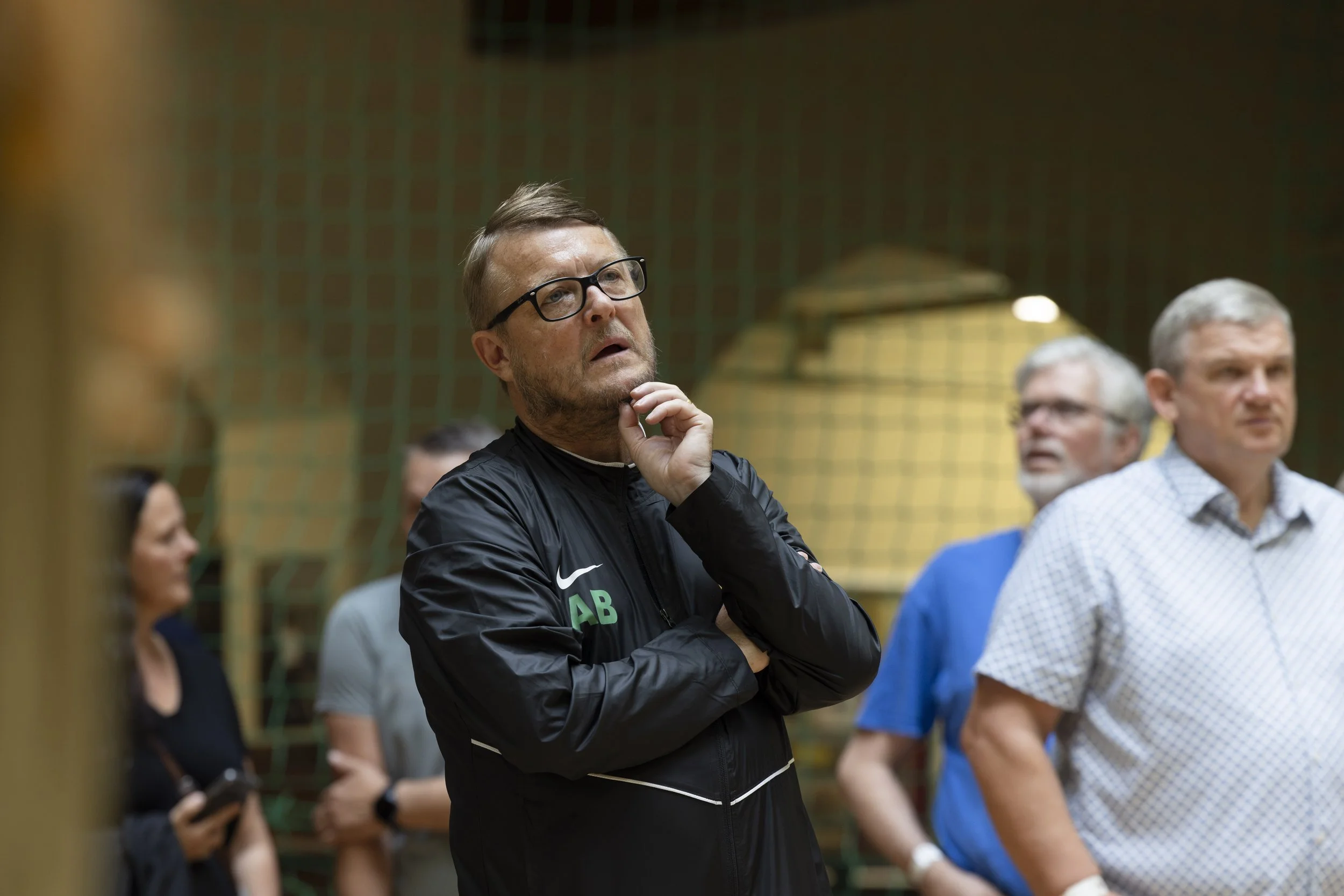 A Manchester United supporter listens to former players speaking during the third kit launch at Salford Lads & Girls Club.