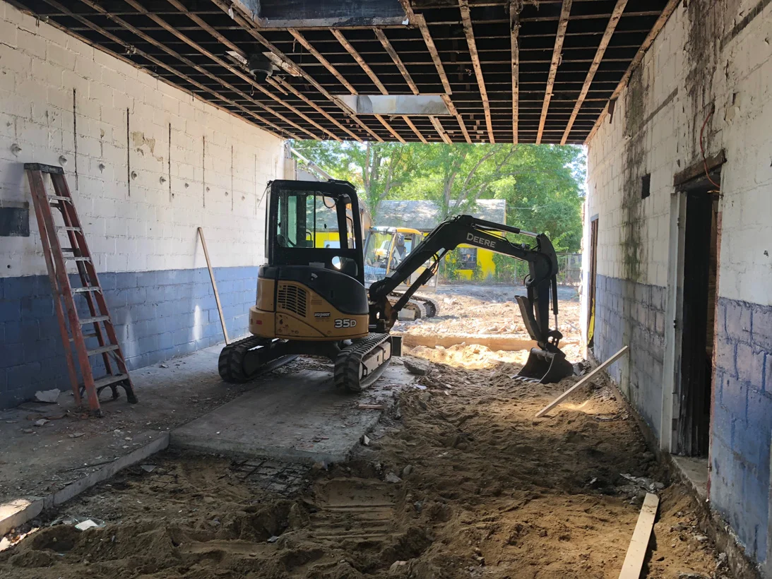 Nothing left but CMU in the studio. Floor settlement issues forced the removal of existing concrete floors.