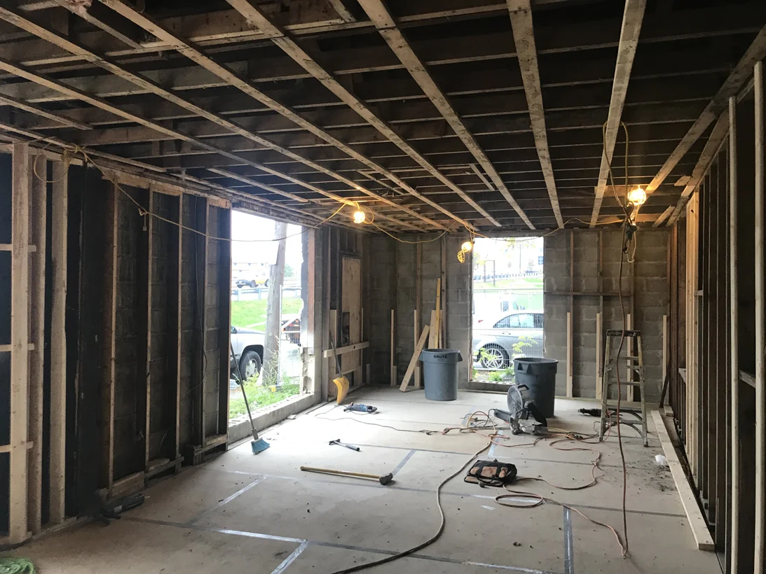 Creating a larger open space and windows within the conference room.