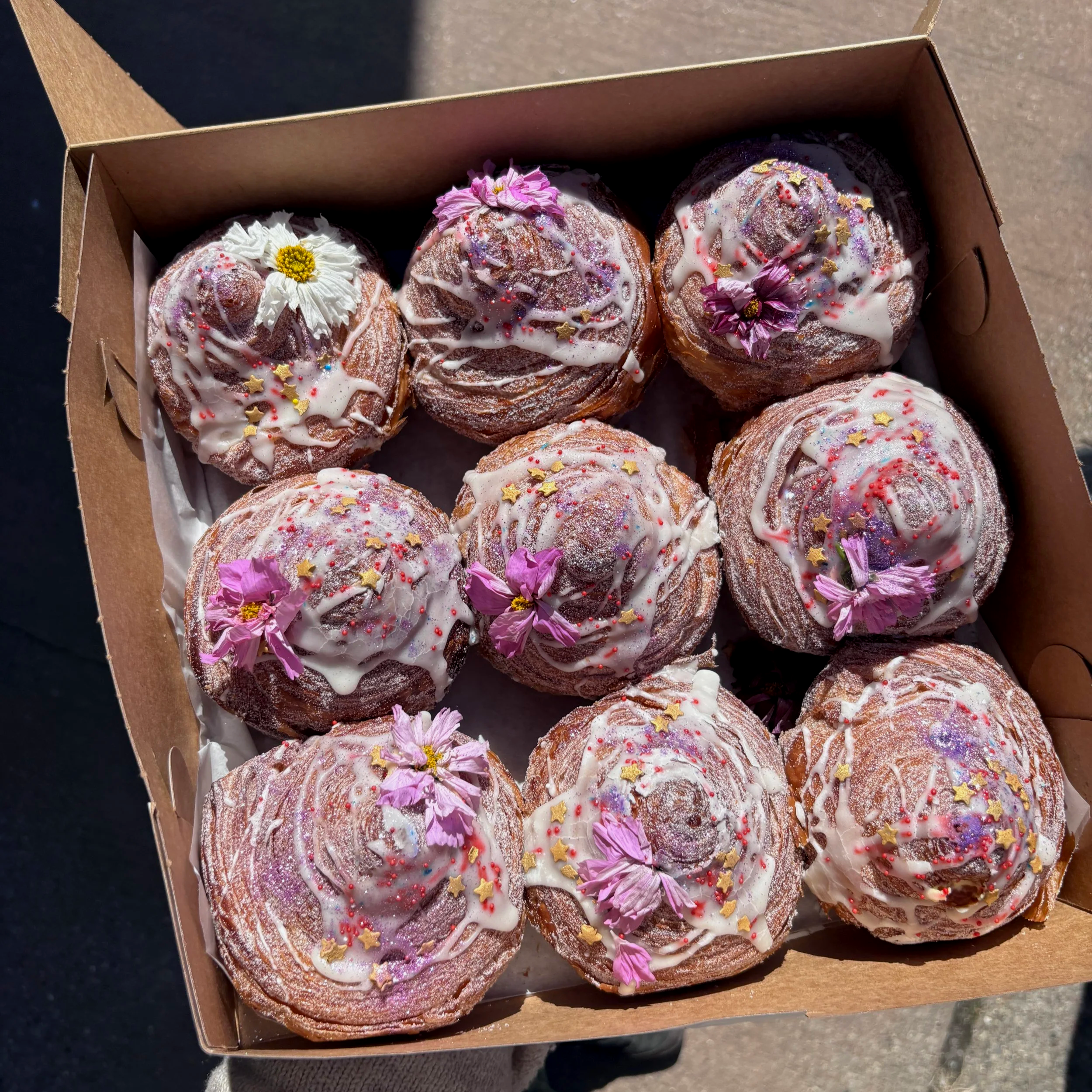 A box full of decorated cruffins