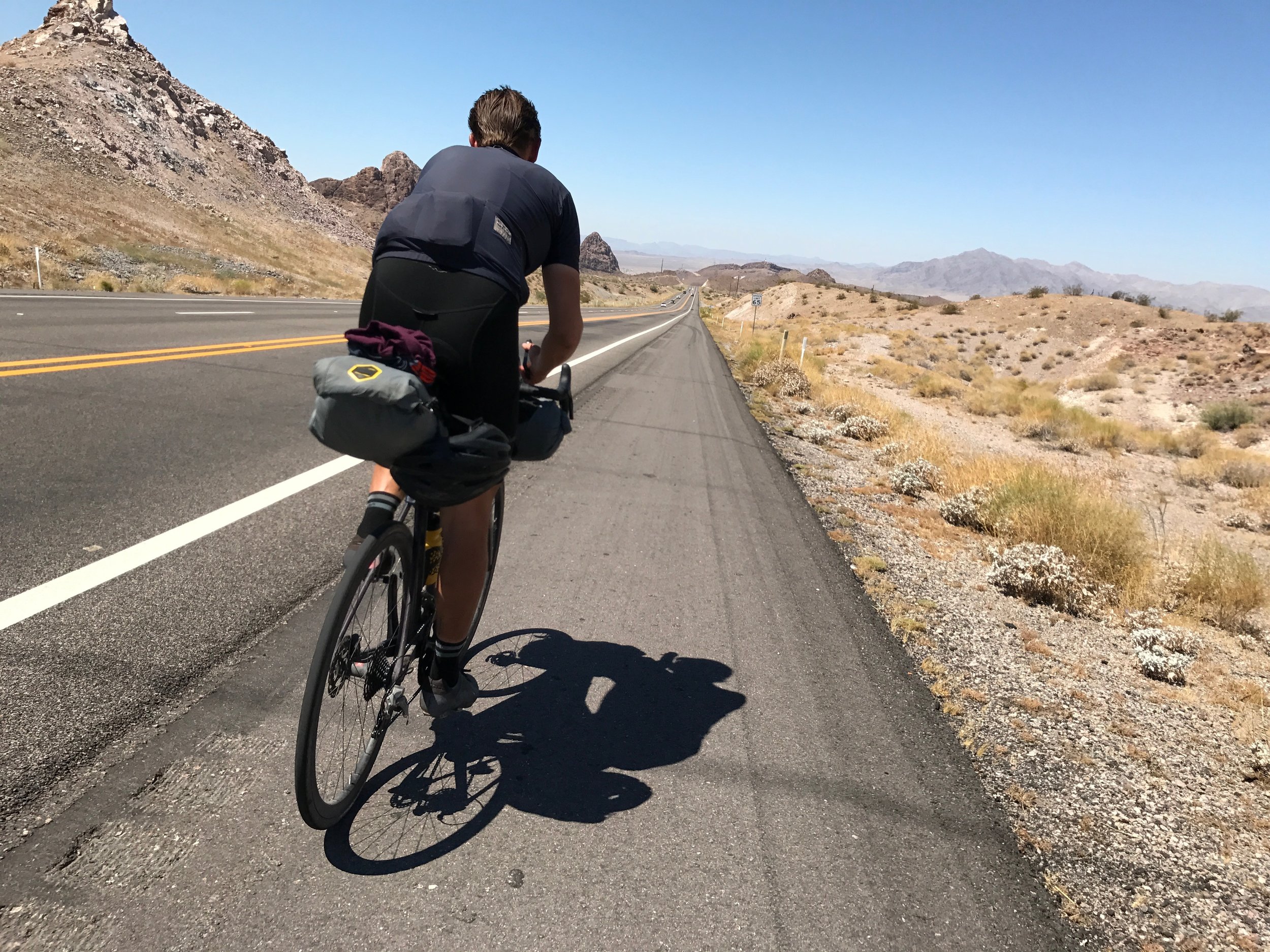 Alex set the tempo into Lake Havasu City. I proceeded to go off-roading and get a flat.