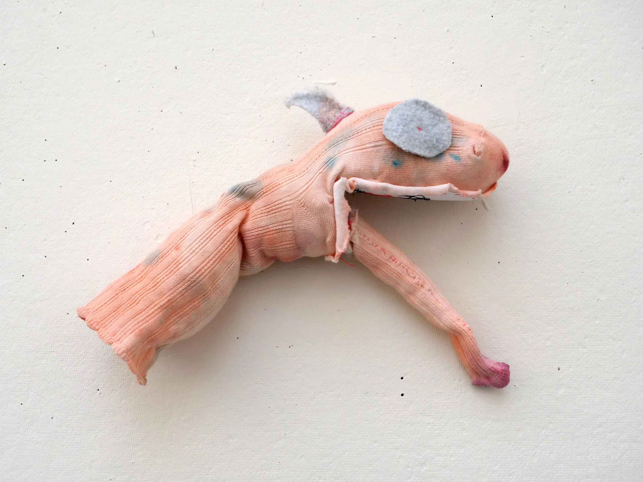   ‘Real Boys Eat (Dysphoria is the Sock Puppet Monster Wreaking Havoc on Childhood Towns)’  approximately 12”x3”x3”, sock, felt, paper, watercolors, and thread 2018 