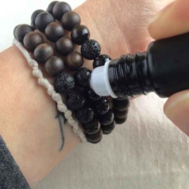 Adding oils to diffuser bracelets.jpg