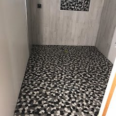 Shower pebble tile floor.jpeg
