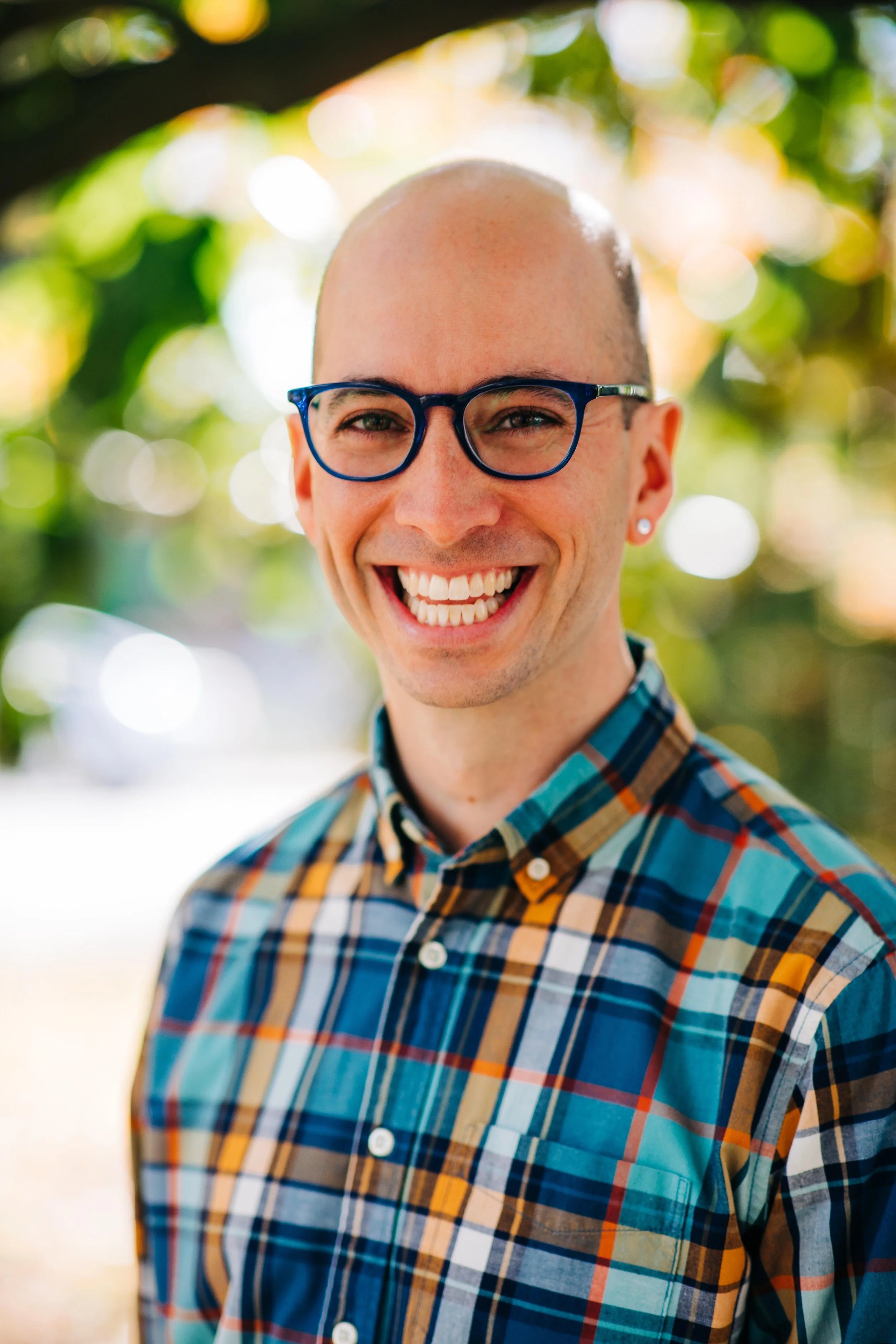 Adam Booth headshot with trees by Pangtography smaller.jpg