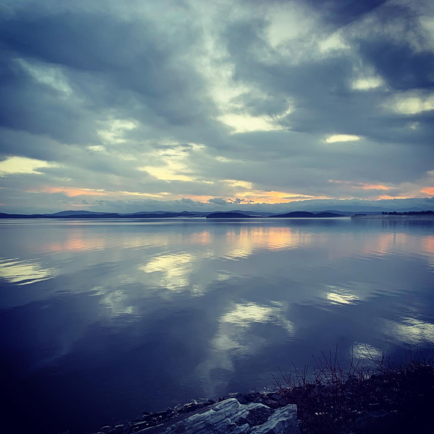 Sunrise and Moonset.  The clouds made a new world here this morning. The lake looked like the sky. Camels hump was cloud covered. Mist settled into coves and low land and I wouldn&rsquo;t have known there was anything there except for the million foo