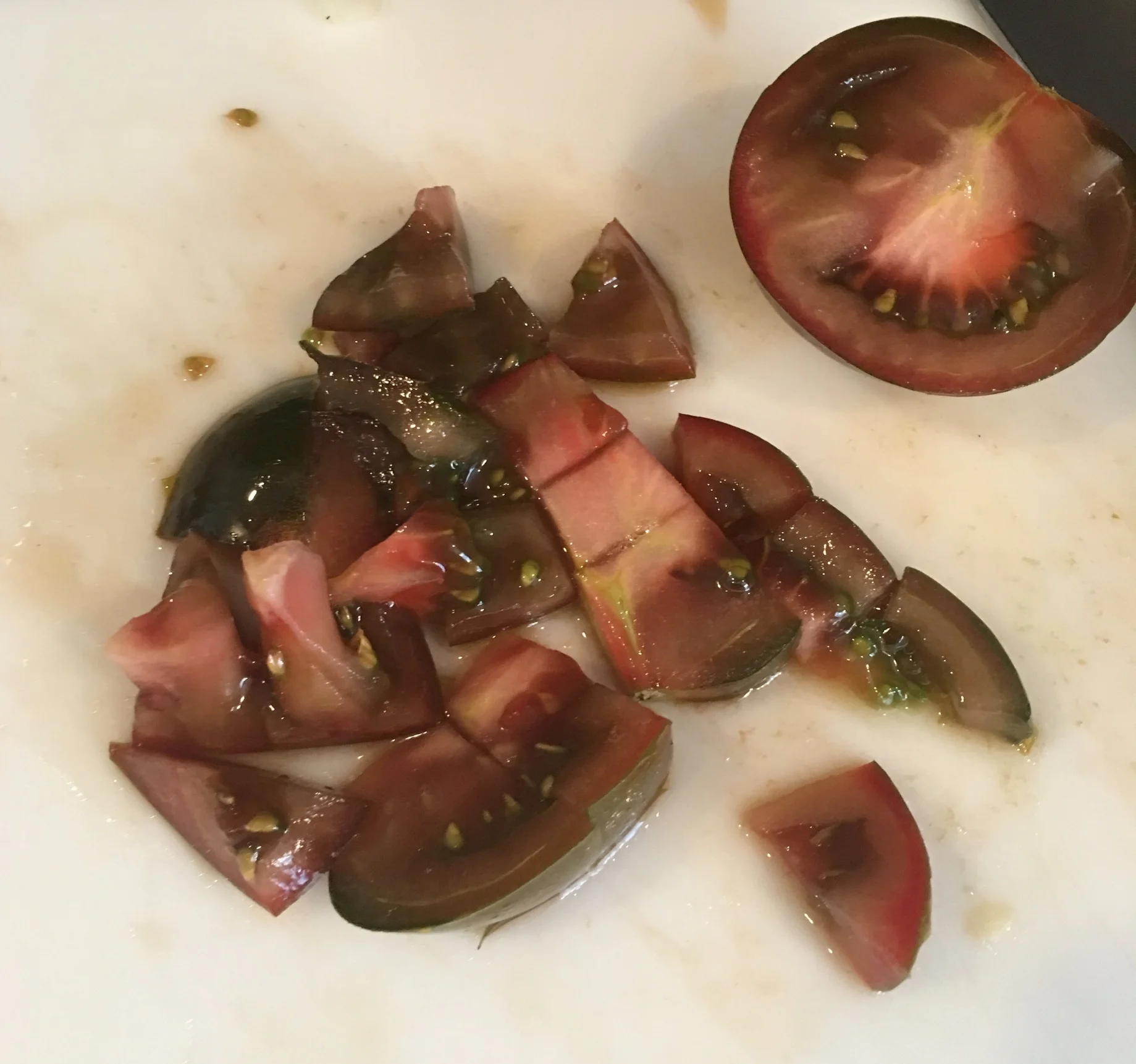 Cutting up the brown tomatoes.