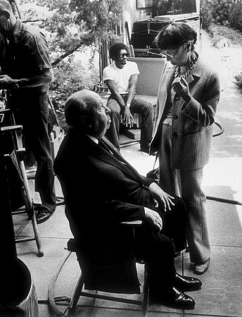 Edith Head working with Alfred Hitchcock at the Universal lot