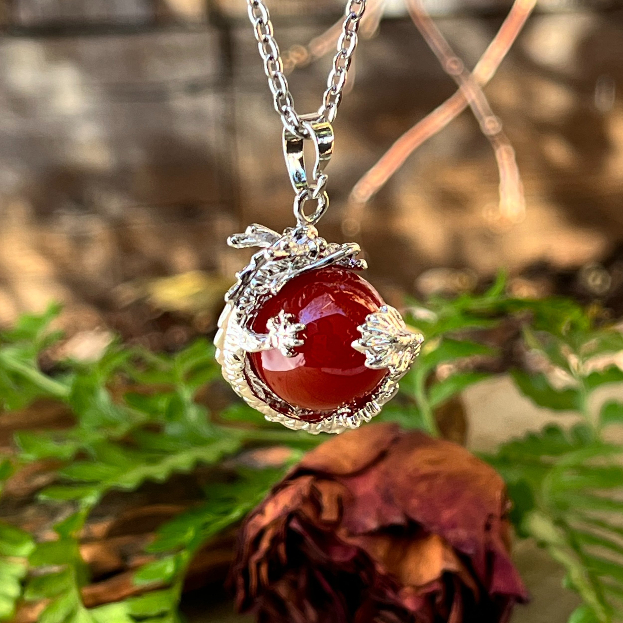 Premium Photo | Red agate necklace on stone