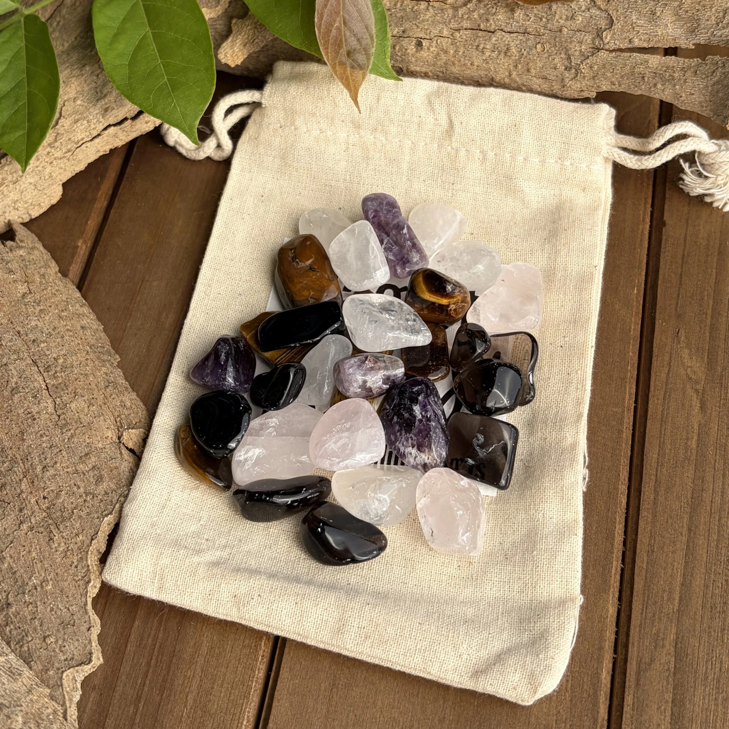 tumbled gemstones in drawstring bag
