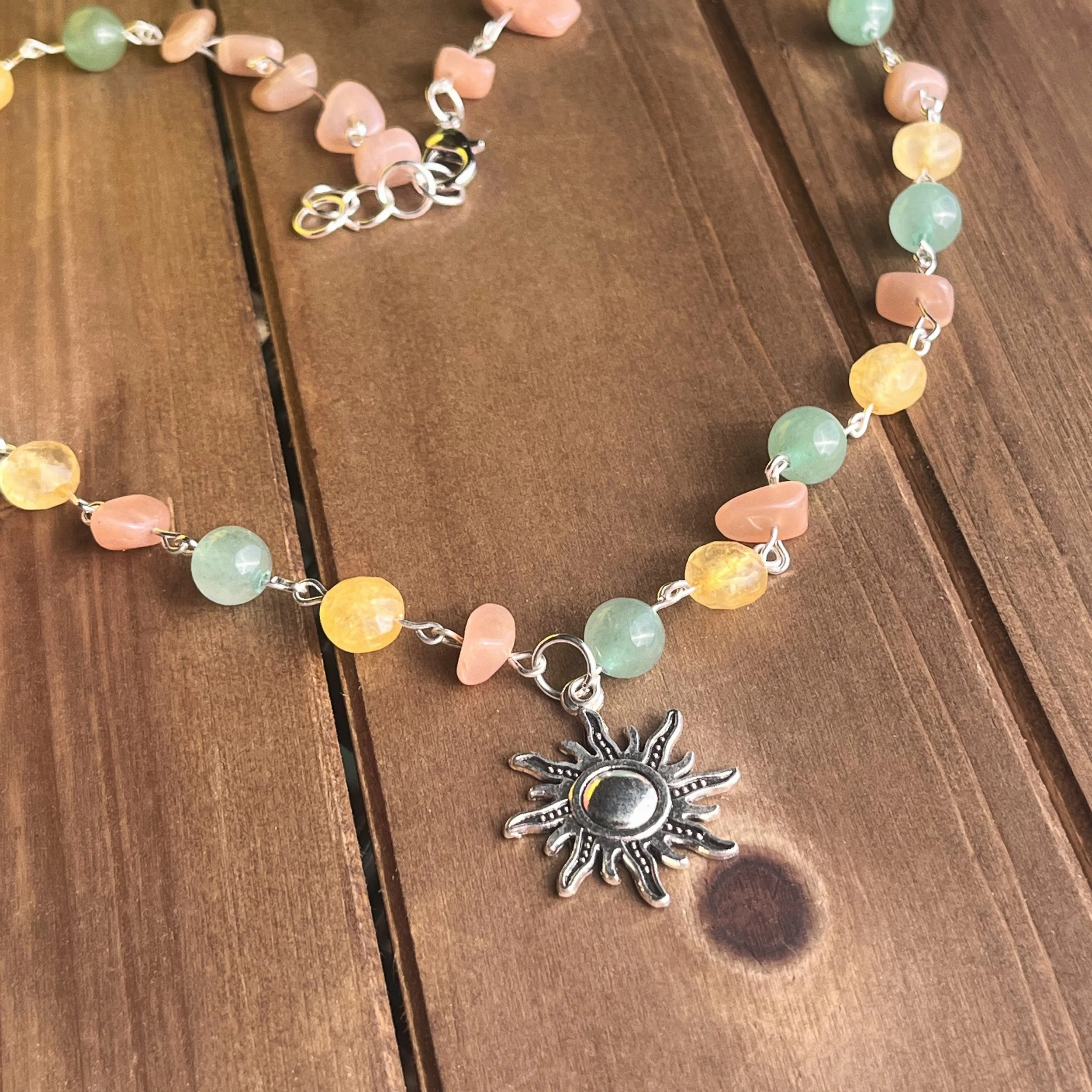 gemstone necklace with sun pendant